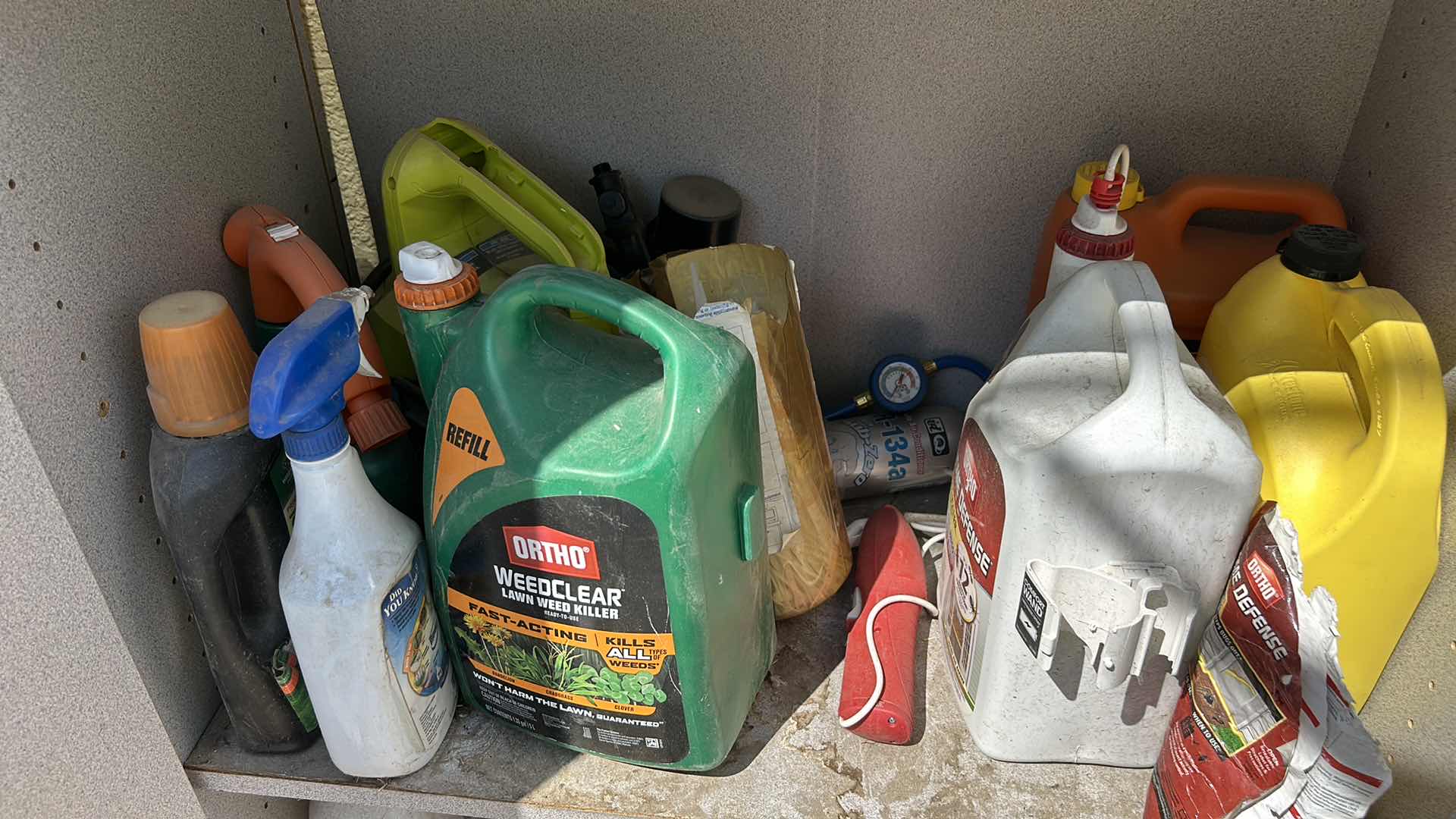 Photo 1 of CONTENTS OF CABINET- LANTERNS, OUTDOOR SUPPLIES , CLEANING SUPPLIES AND MORE