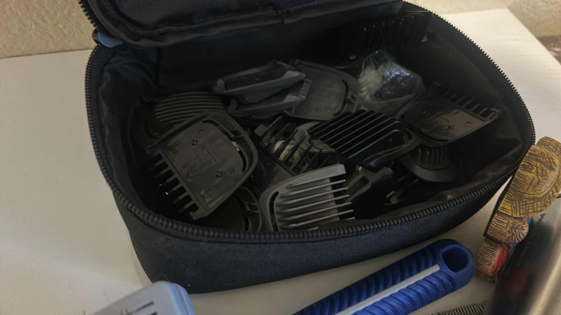 Photo 3 of DOG GROOMING ITEMS WITH CLIPPERS, BRUSHES, AND THREE MAGNETS.