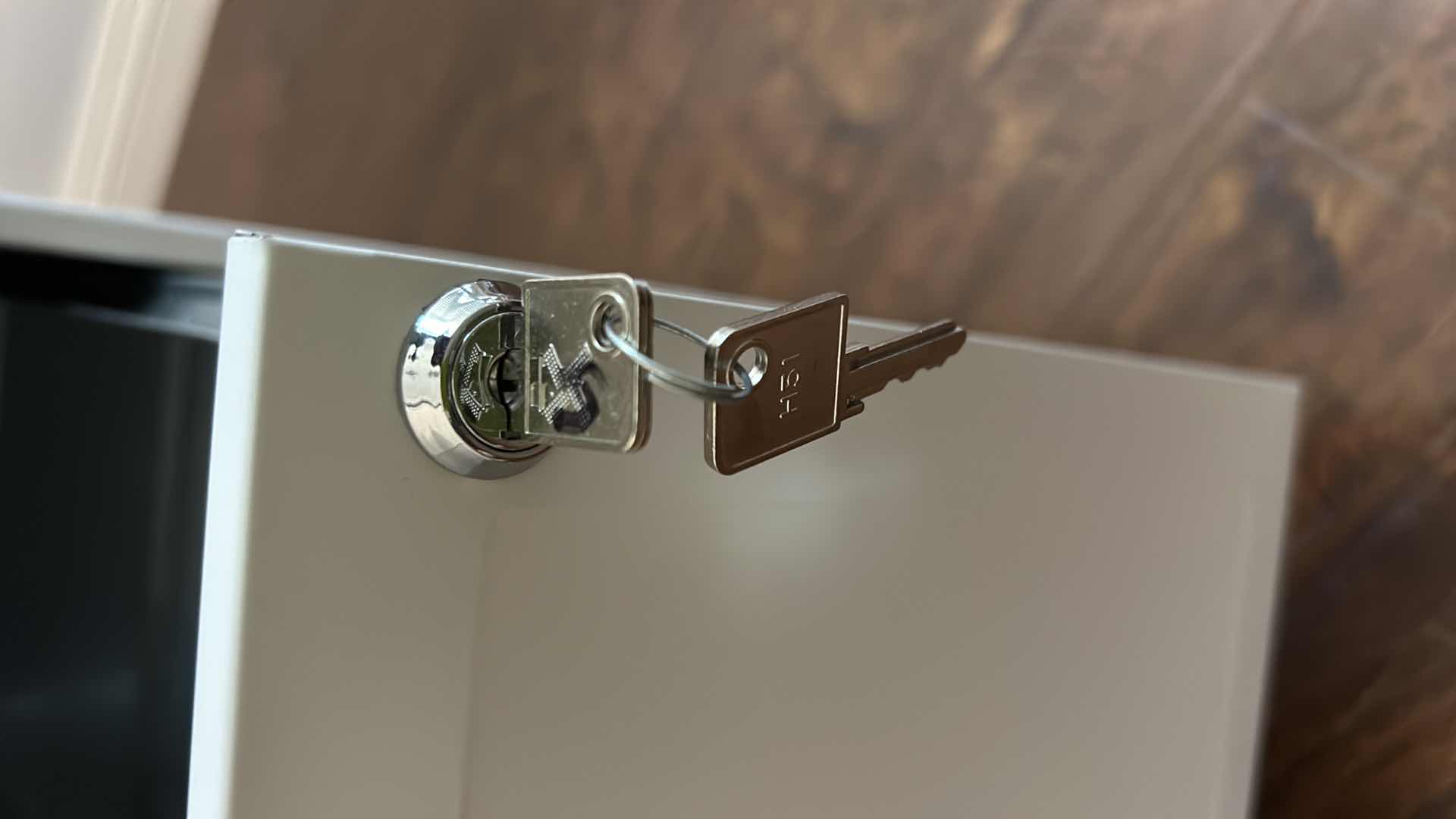 Photo 1 of LOCKING TWO-DOOR METAL FILE CABINET ON WHEELS WITH KEY. 14 1/4" X 18" X H 27"