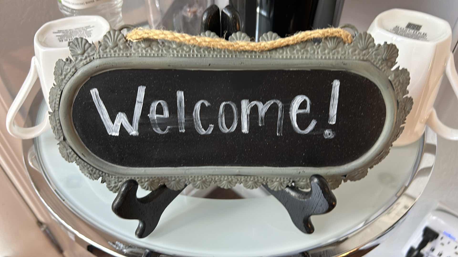 Photo 1 of COFFEE STATION - VERISMO COFFEE MAKER . WELCOME SIGN. TWO BONECHINA COFFEE MUGS BY ROCHERE & ANTHEM COUNTRY CLUB BOTTLED WATER.