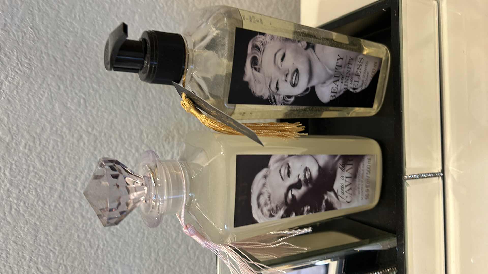 Photo 1 of MARILYN MONROE BATHROOM ACCESSORIES. CHAMPAGNE-SCENTED HAND SOAP. FAME IS LIKE CAVIAR-SCENTED BUBBLE BATH.