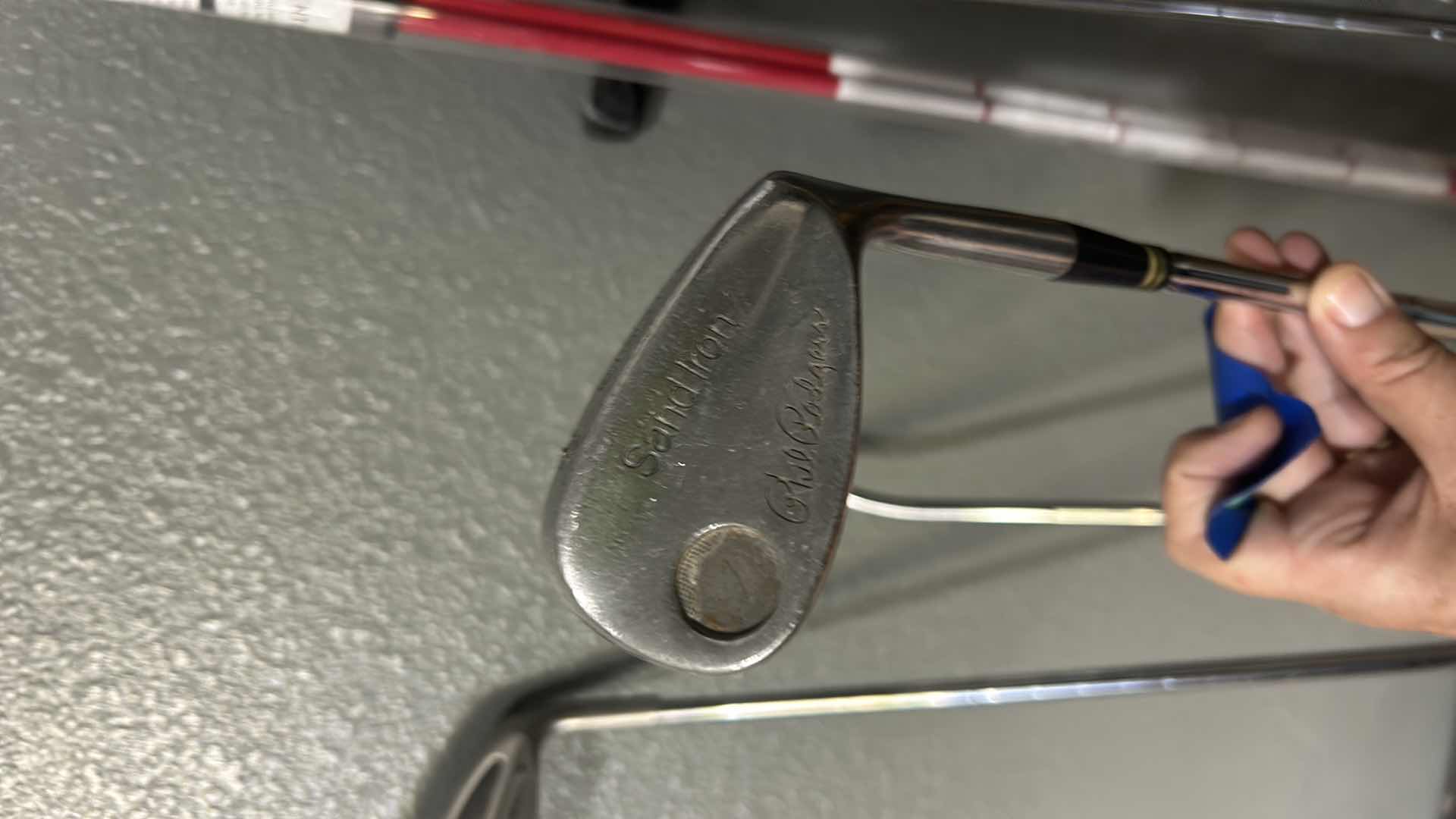 Photo 1 of FOUR GOLF CLUBS AND ONE ALIGNMENT POLE GOLF ACCESSORY.