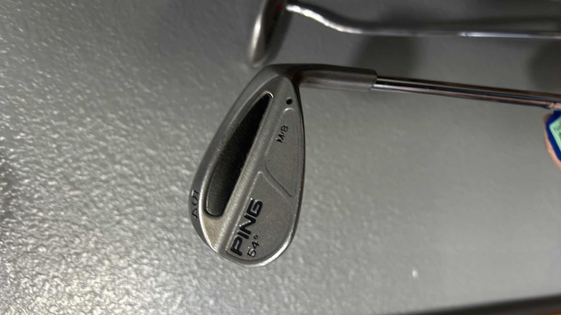 Photo 2 of FOUR GOLF CLUBS AND ONE ALIGNMENT POLE GOLF ACCESSORY.