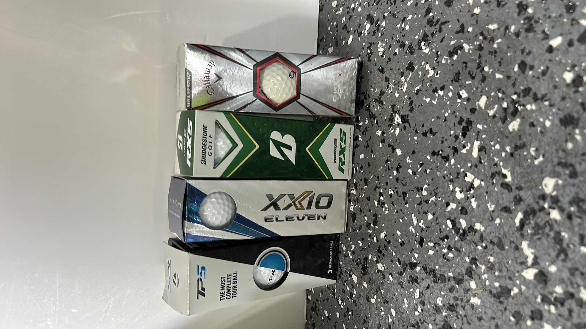 Photo 2 of 4 NEW BOXES OF GOLF BALLS, A WRENCH, AND MORE.
