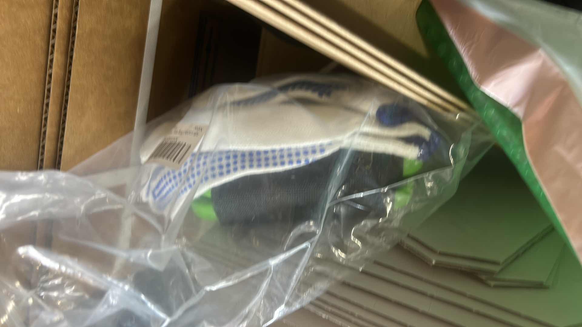 Photo 1 of MOVING AND PACKING MATERIALS, INCLUDING TWO TALL WARDROBE BOXES, GLOVES, AND ACCESSORIES.