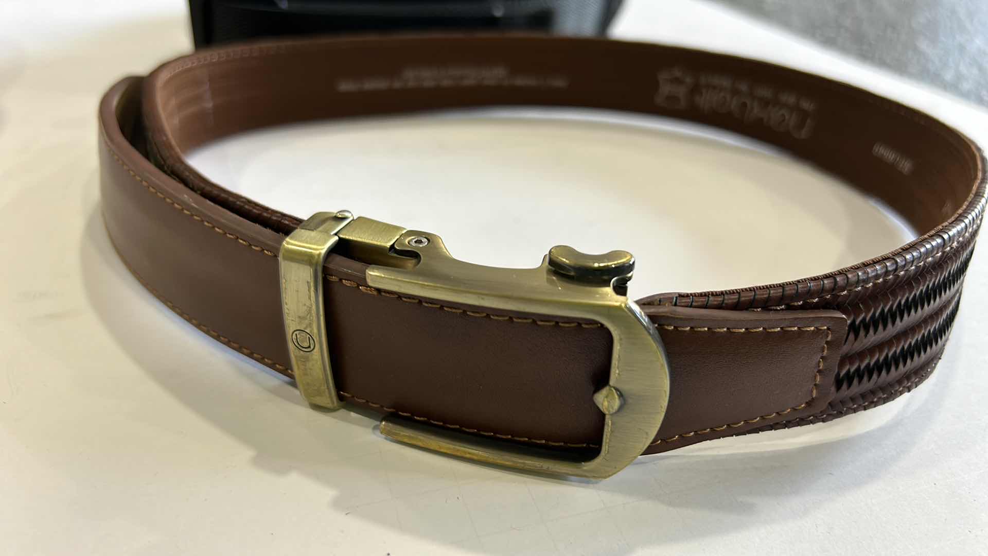 Photo 1 of MENS ASSORTMENT- COWBOY HAT, BELTS, BINOCULARS AND MORE