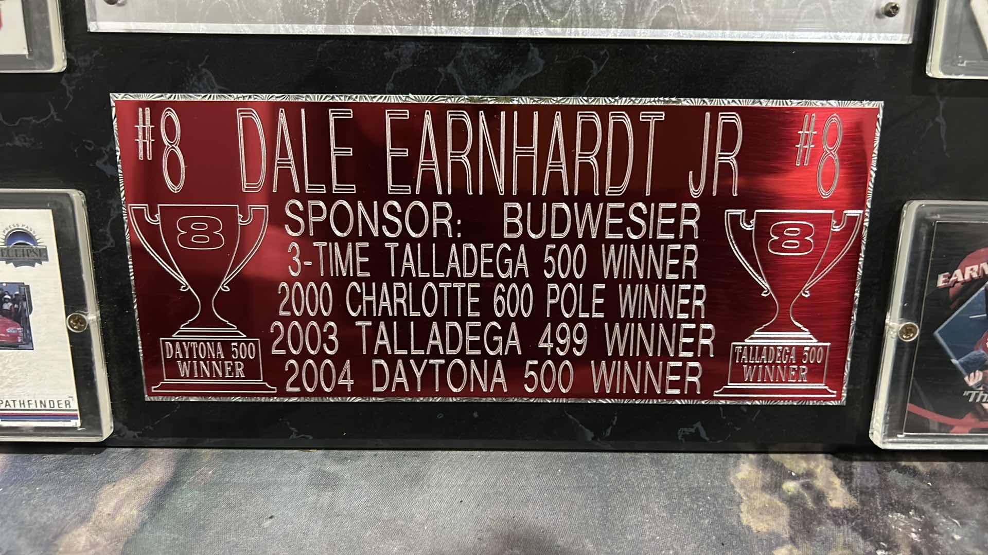 Photo 1 of DALE EARNHARDT COLLECTIBLE MEMORABILIA, SPORTS CARDS, AND MORE. 18“ x H16“