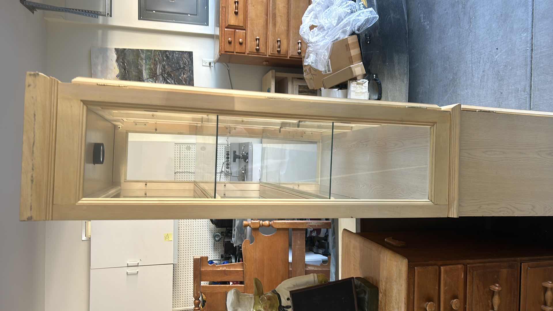 Photo 1 of HOME FURNISHINGS - LIGHT WOOD CURIO/CHINA CABINET WITH TWO GLASS SHELVES AND TWO DRAWERS. 42” X 15” X 79”.