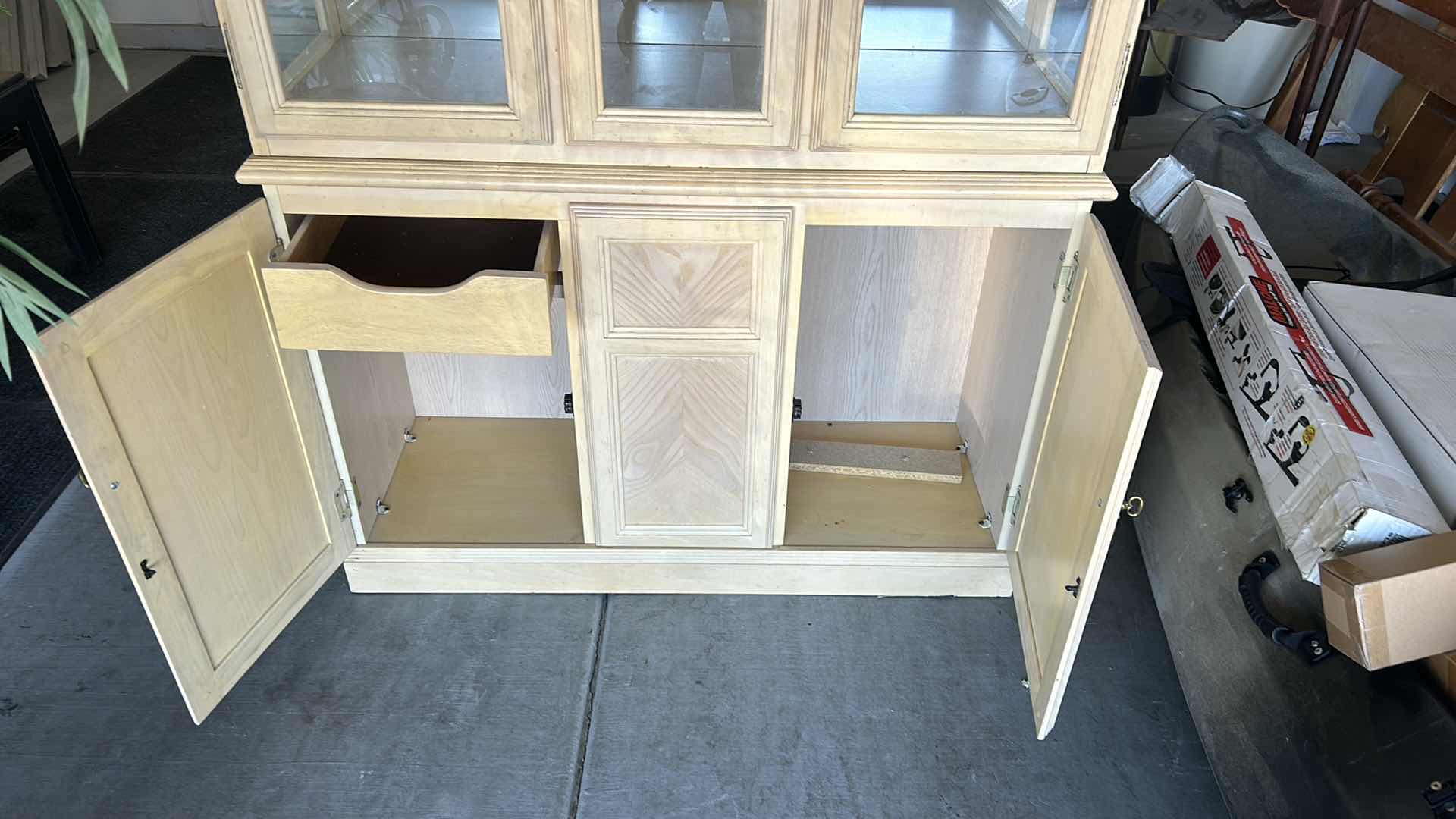 Photo 1 of HOME FURNISHINGS - LIGHT WOOD CURIO/CHINA CABINET WITH TWO GLASS SHELVES AND TWO DRAWERS. 42” X 15” X 79”.