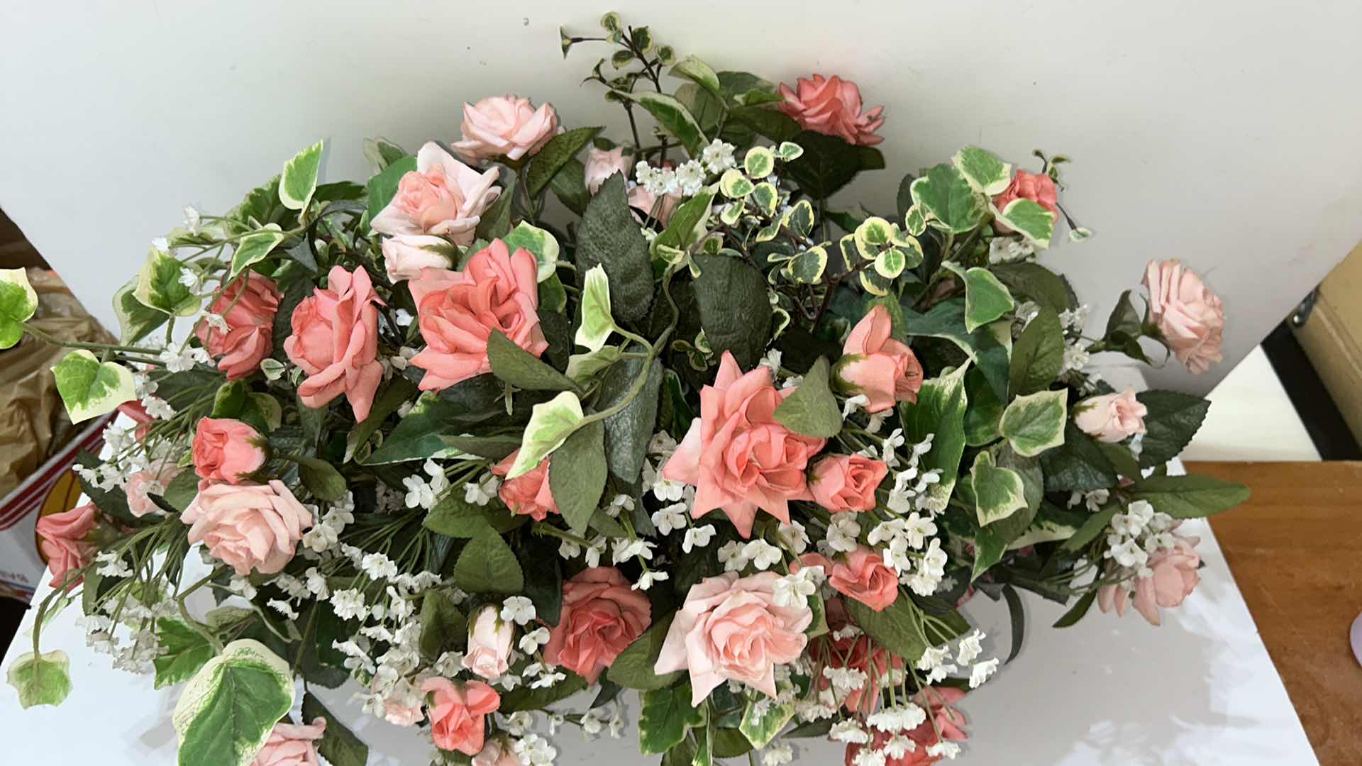 Photo 1 of HOME DECOR, ROSE FAUX FLORAL ARRANGEMENT IN WICKER BASKET, 29” X H16”.