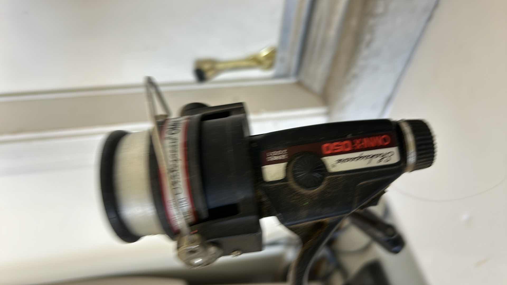 Photo 1 of TWO FISHING RODS AND REELS