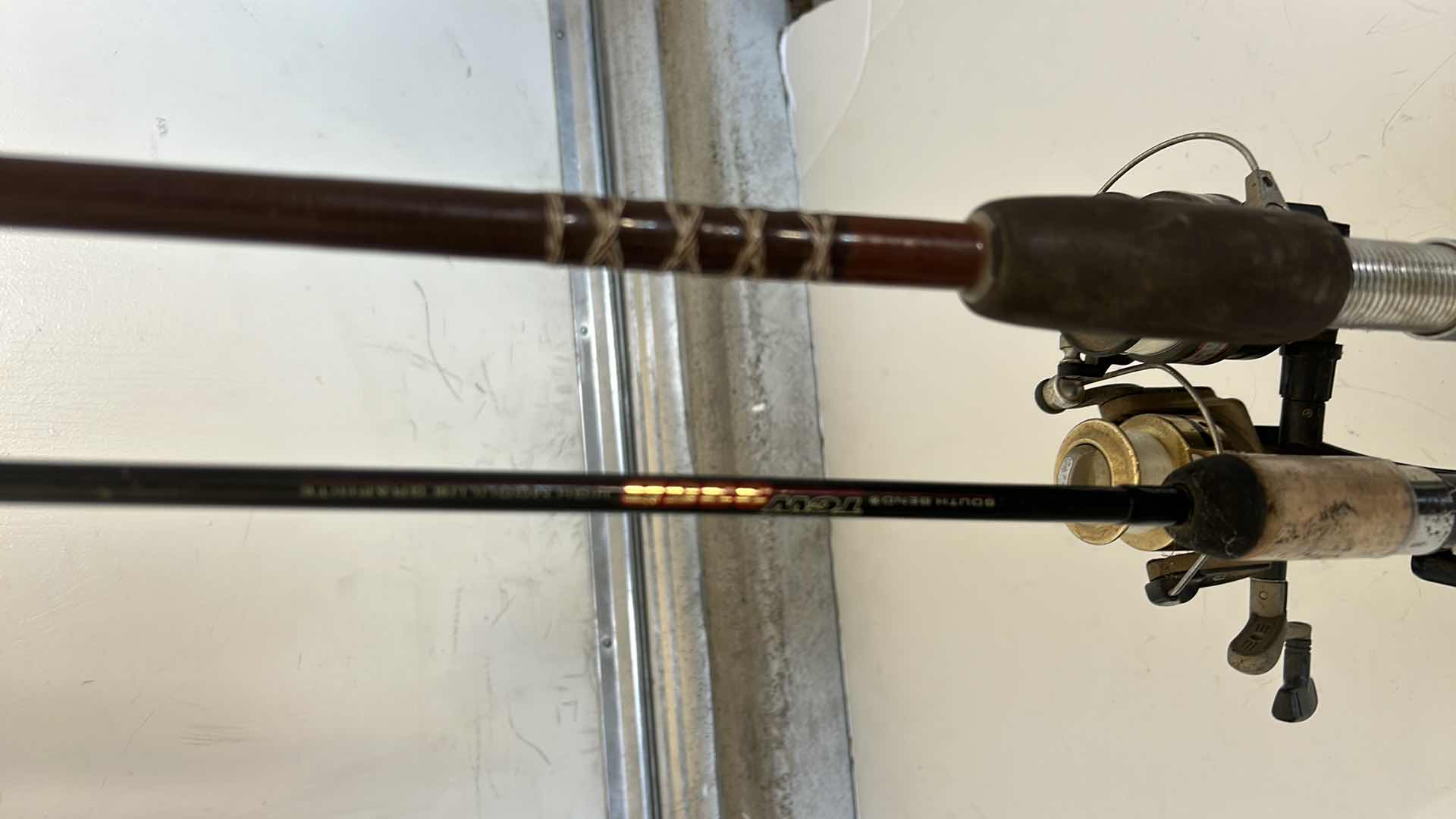 Photo 1 of TWO FISHING RODS AND REELS