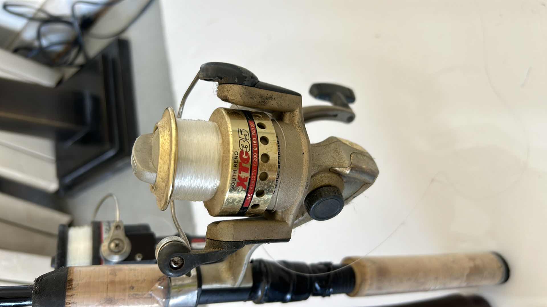 Photo 1 of TWO FISHING RODS AND REELS