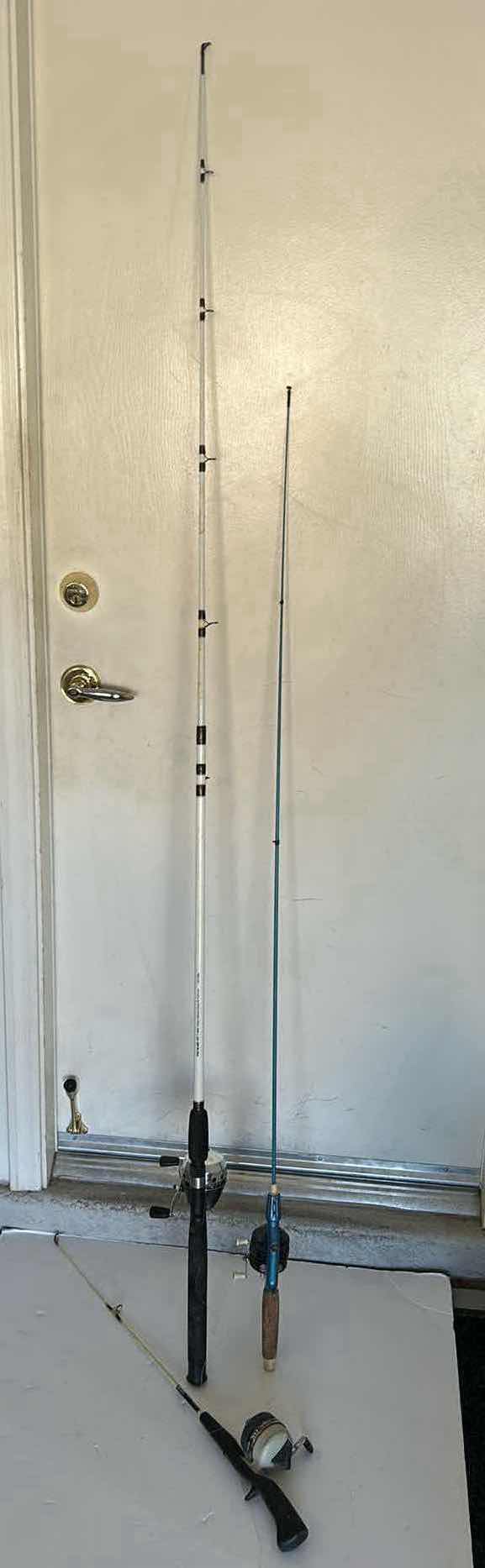 Photo 2 of THREE FISHING RODS AND REELS