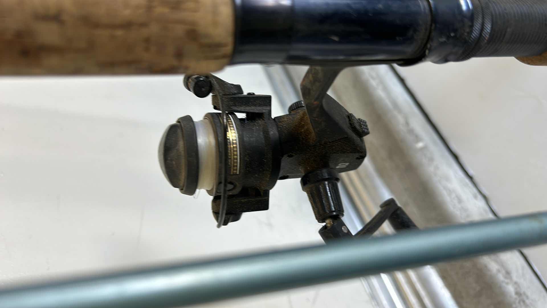 Photo 1 of TWO FISHING RODS AND REELS