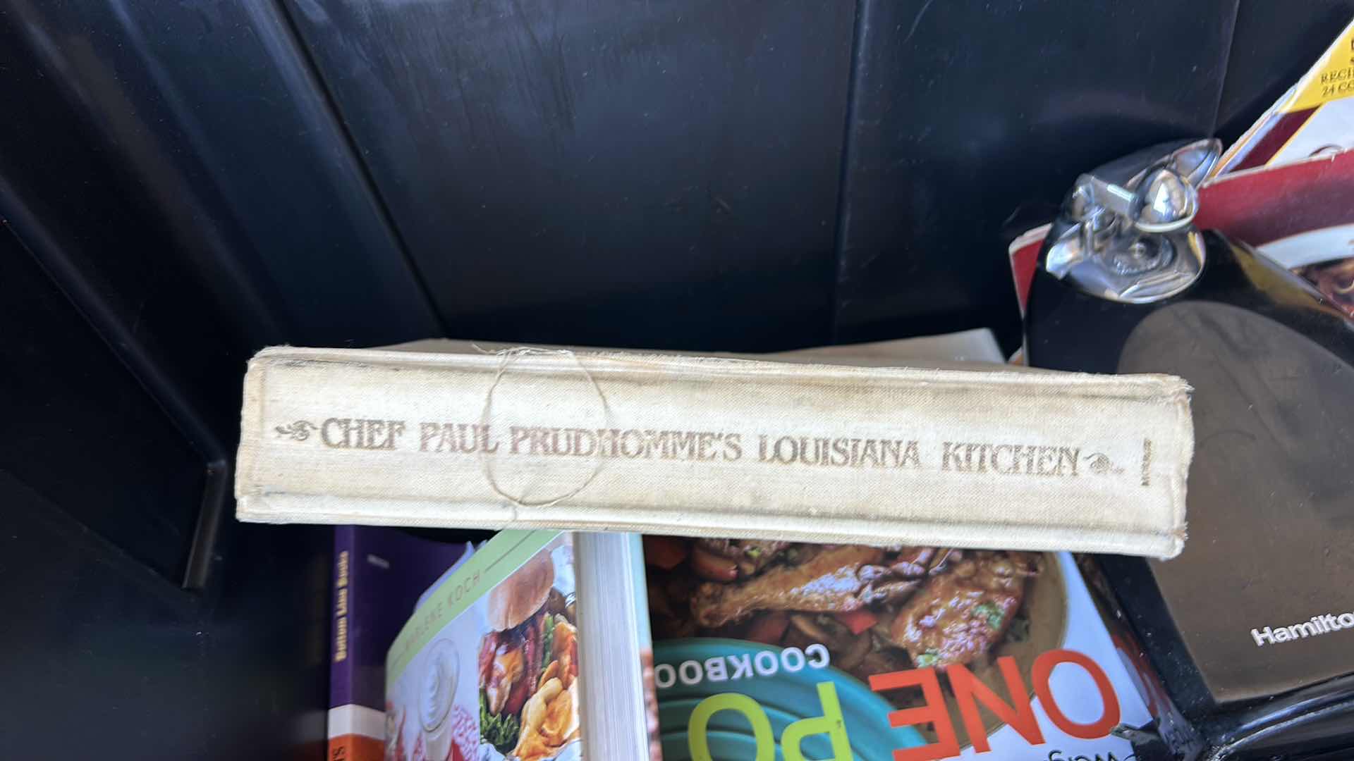 Photo 1 of LARGE TOTE FULL OF RECIPE BOOKS AND ONE CAN OPENER.