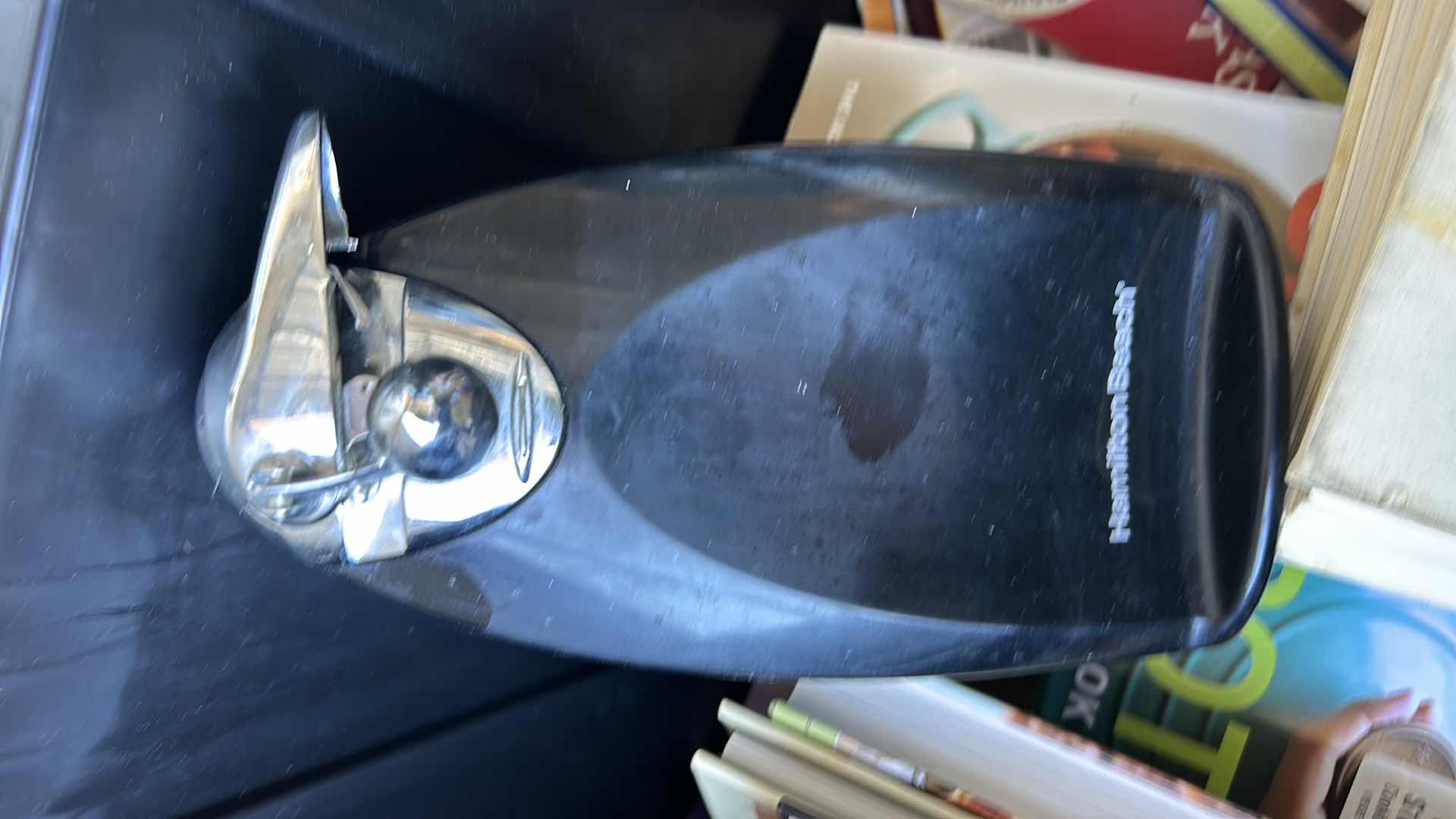 Photo 1 of LARGE TOTE FULL OF RECIPE BOOKS AND ONE CAN OPENER.