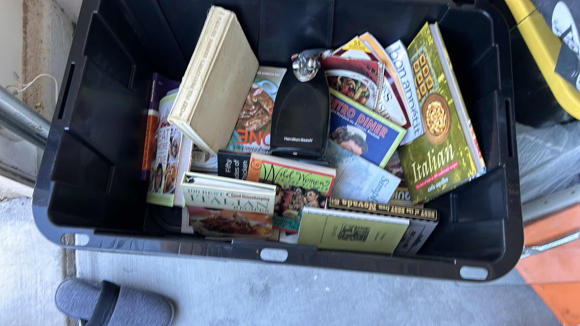Photo 1 of LARGE TOTE FULL OF RECIPE BOOKS AND ONE CAN OPENER.
