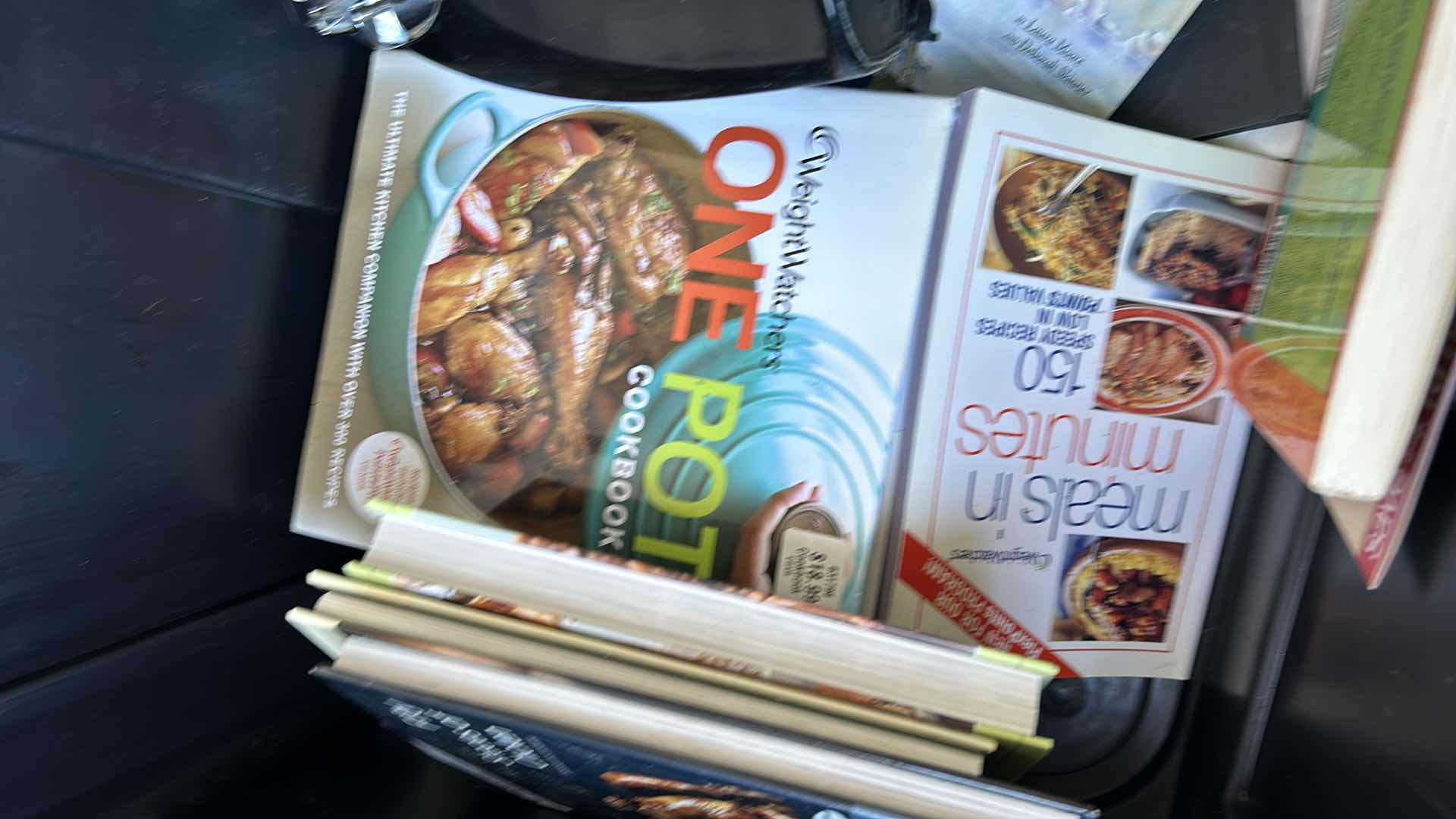 Photo 1 of LARGE TOTE FULL OF RECIPE BOOKS AND ONE CAN OPENER.