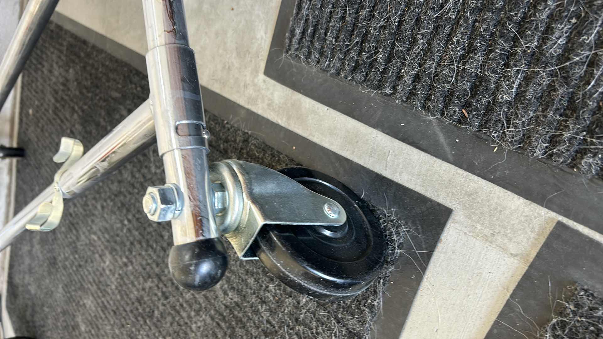 Photo 1 of STURDY, COLLAPSIBLE CLOTHING RACK ON WHEELS.