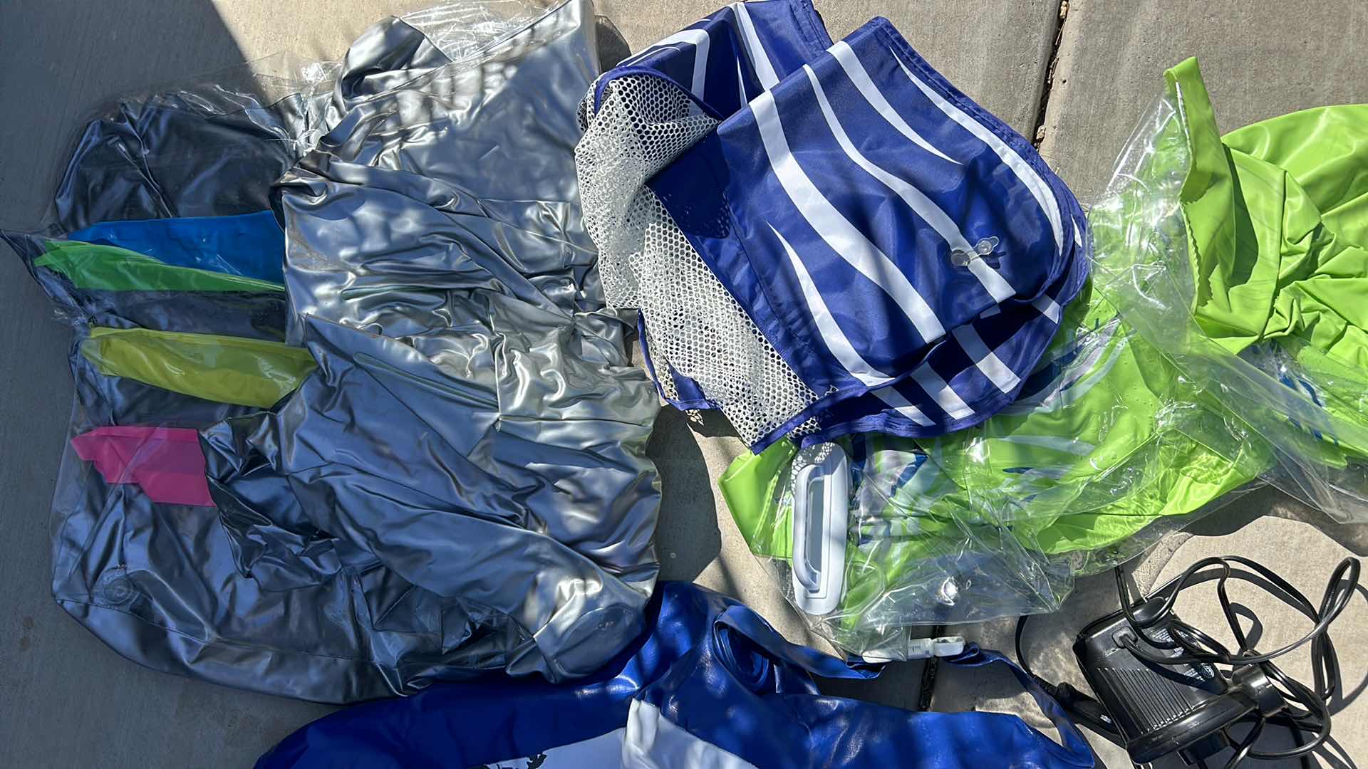 Photo 1 of POOL AND LAKE FLOATIES AND PUMP.