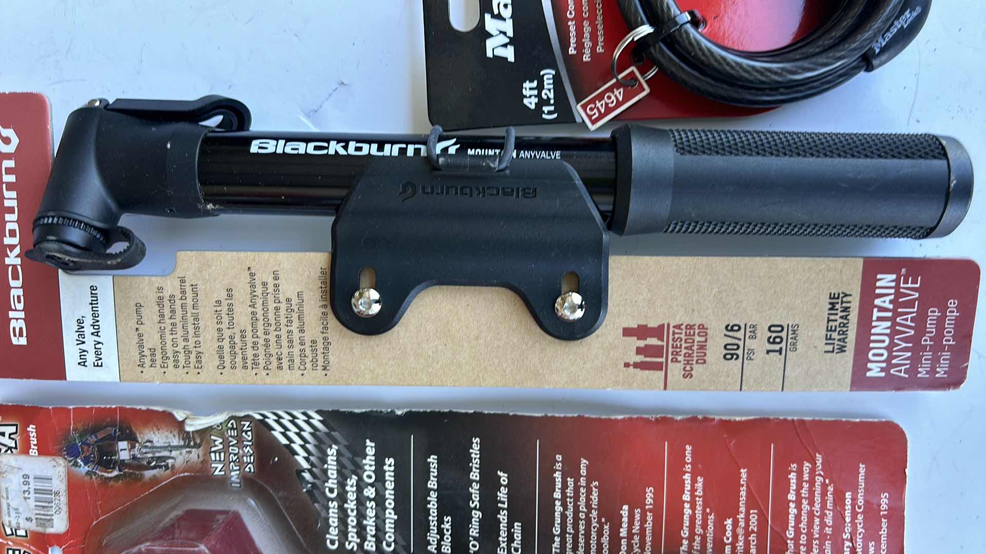 Photo 1 of NEW ITEMS MOTORCYCLE AND MOUNTAIN BIKE CHAIN CLEANER, MOUNTAIN ANYVALVE MINI PUMP, MASTER LOCK STORAGE.