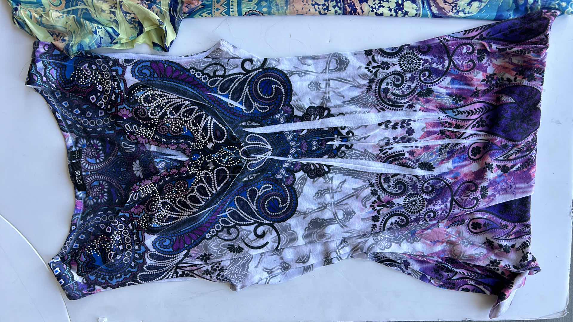 Photo 1 of WOMEN’S WEAR 10 TOP SIZE SMALL/MEDIUM.