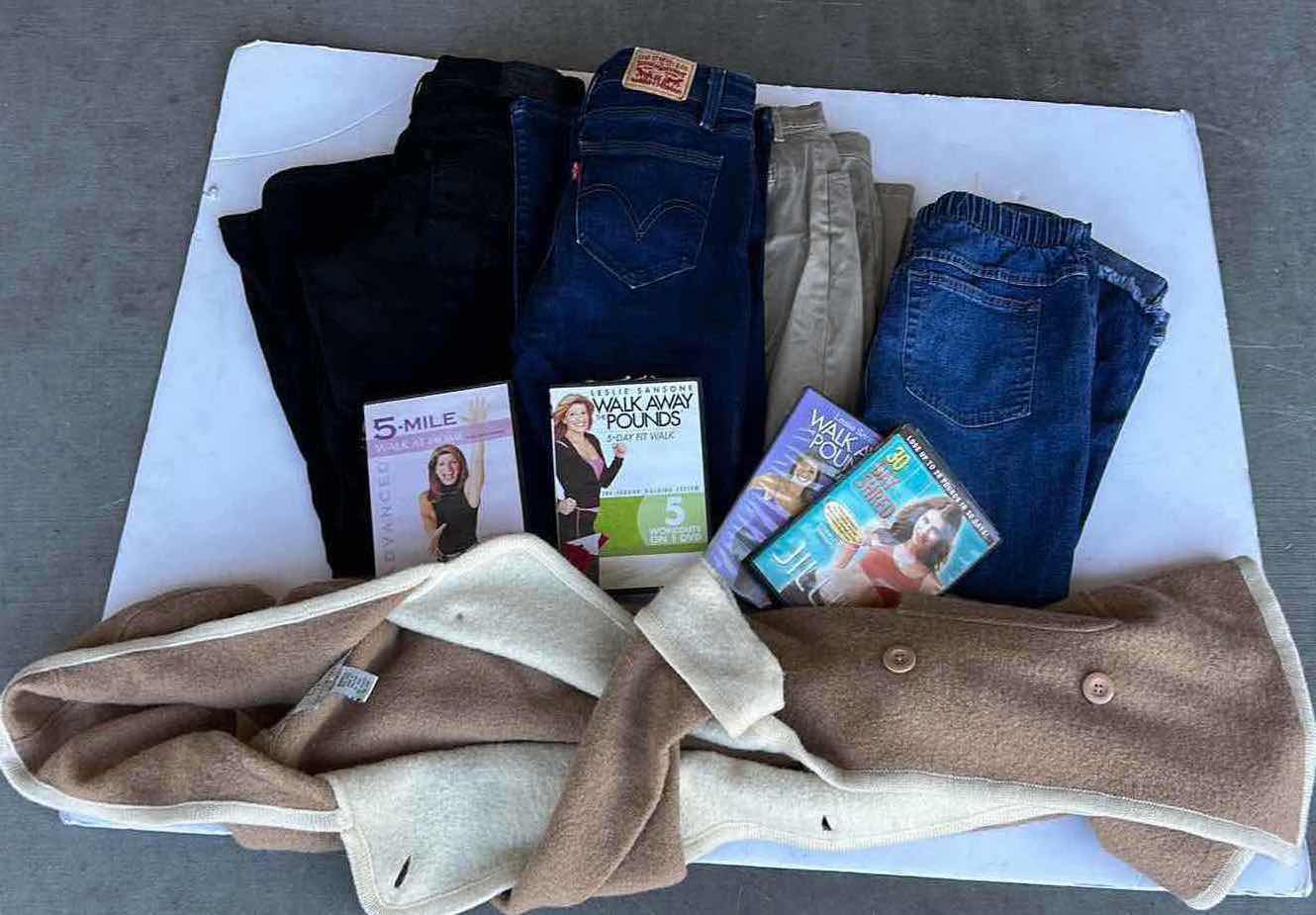 Photo 1 of WOMENS CLOTHING - 4 PAIRS OF PANTS 27, 28 PETITE, WORKOUT TAPES AND SWEATER JACKET S/M