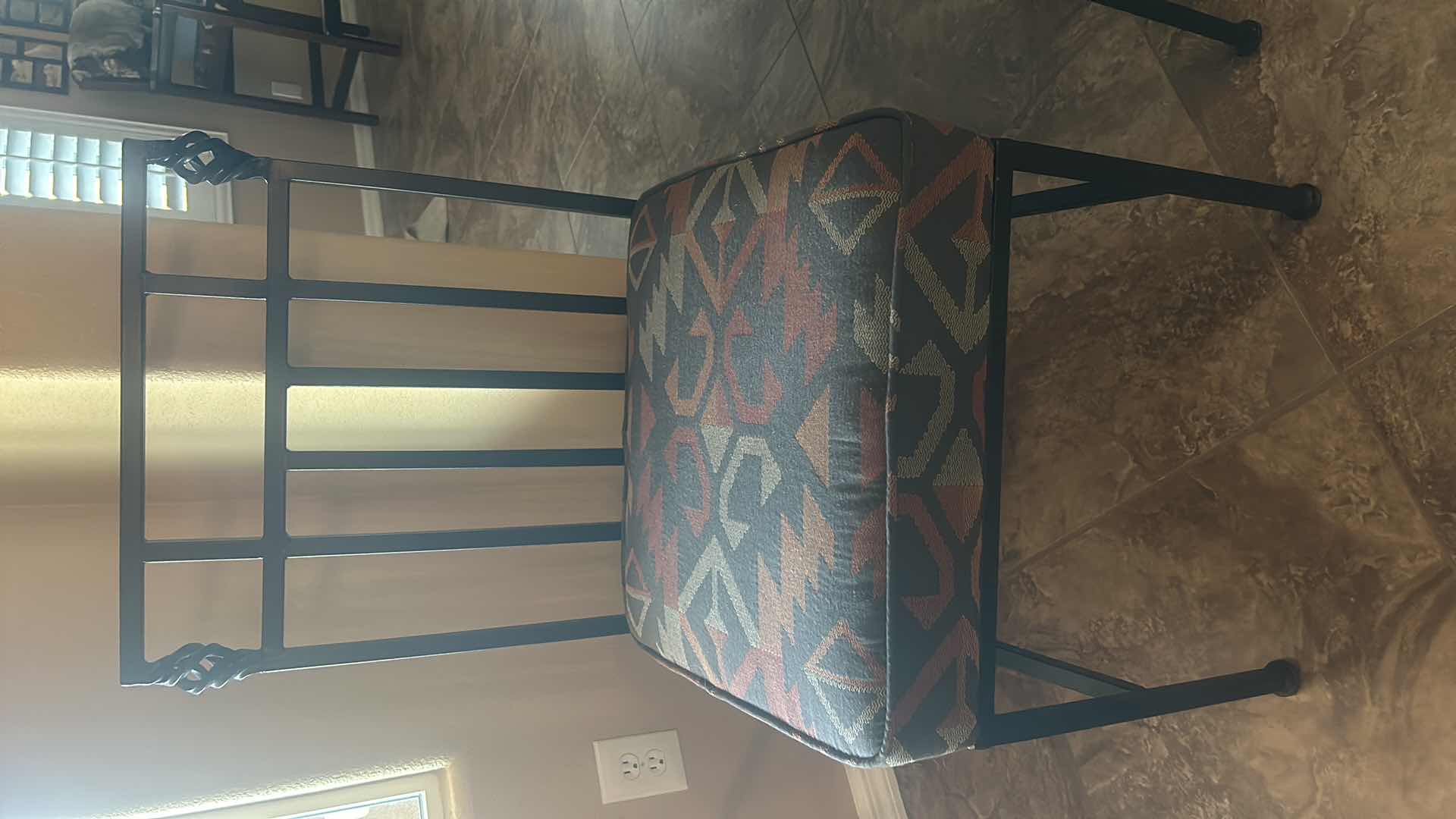 Photo 1 of HEAVY IRON CHAIR WITH THICK UPHOLSTERED PADDING.