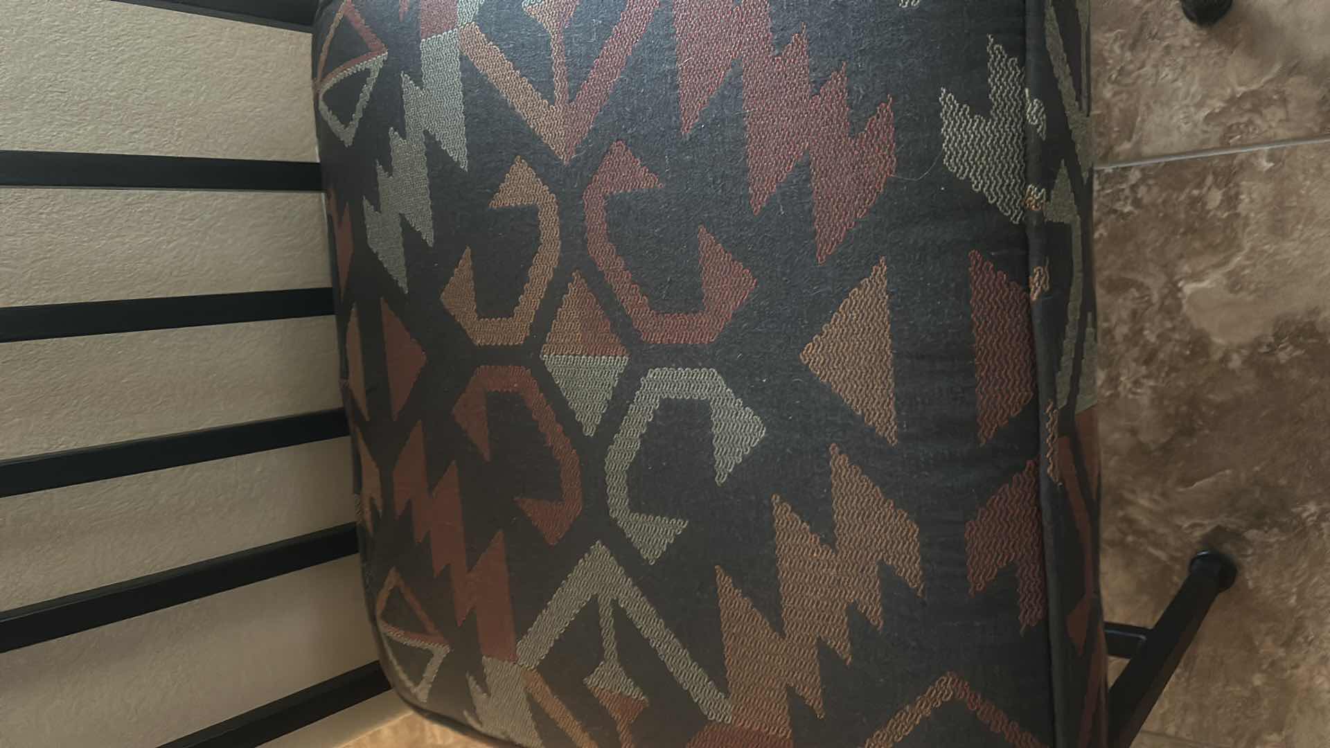 Photo 1 of HEAVY BLACK WROUGHT IRON CHAIR WITH THICK UPHOLSTERED PADDING.