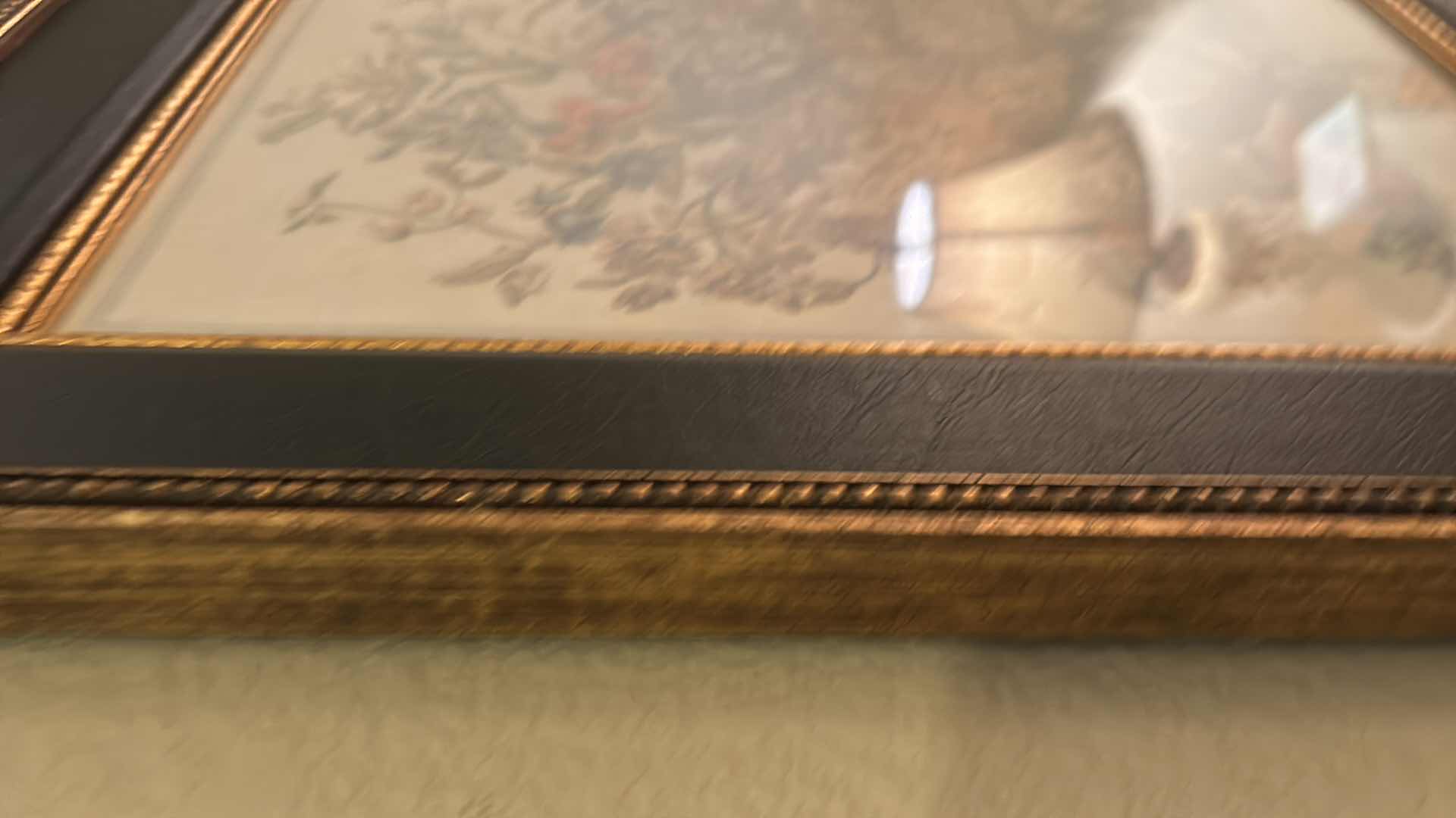 Photo 1 of GOLD-FRAMED JULY FLORAL ARTWORK, 17.5” X H 21.5”.