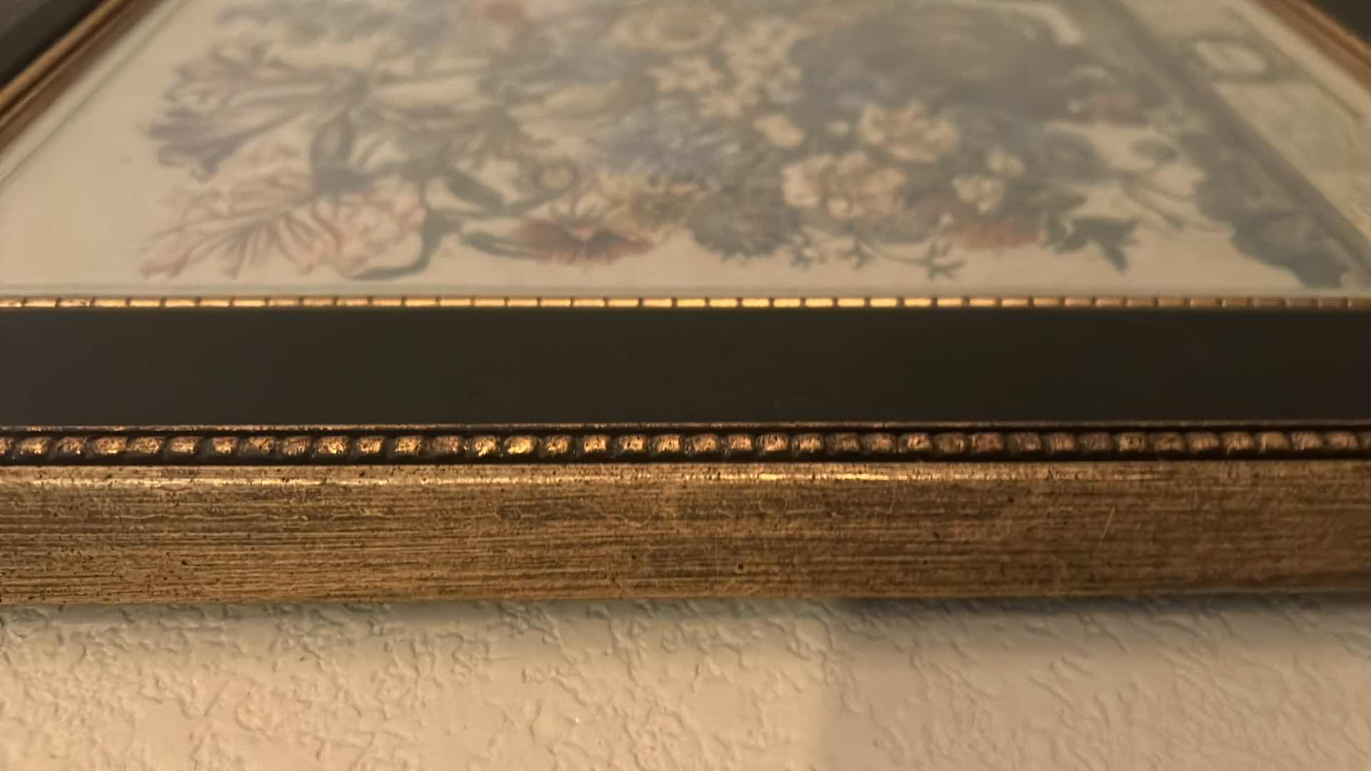 Photo 1 of GOLD-FRAMED OCTOBER FLORAL ARTWORK, 17.5” X H 21.5”.