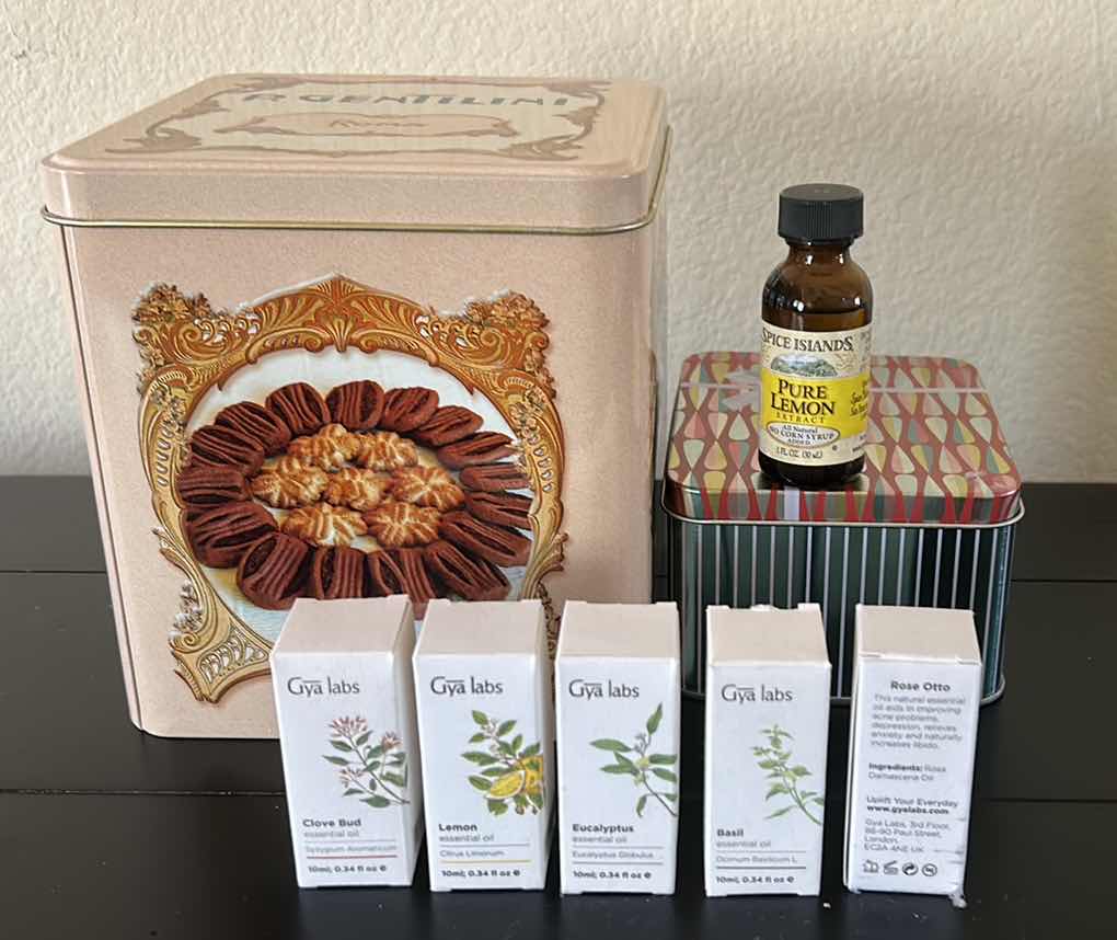 Photo 1 of 2 TINS AND ESSENTIAL OILS