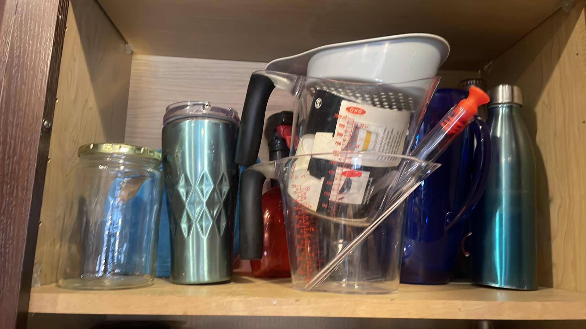 Photo 3 of CONTENTS OF CABINET - TRAVEL AND MEASURING CUPS