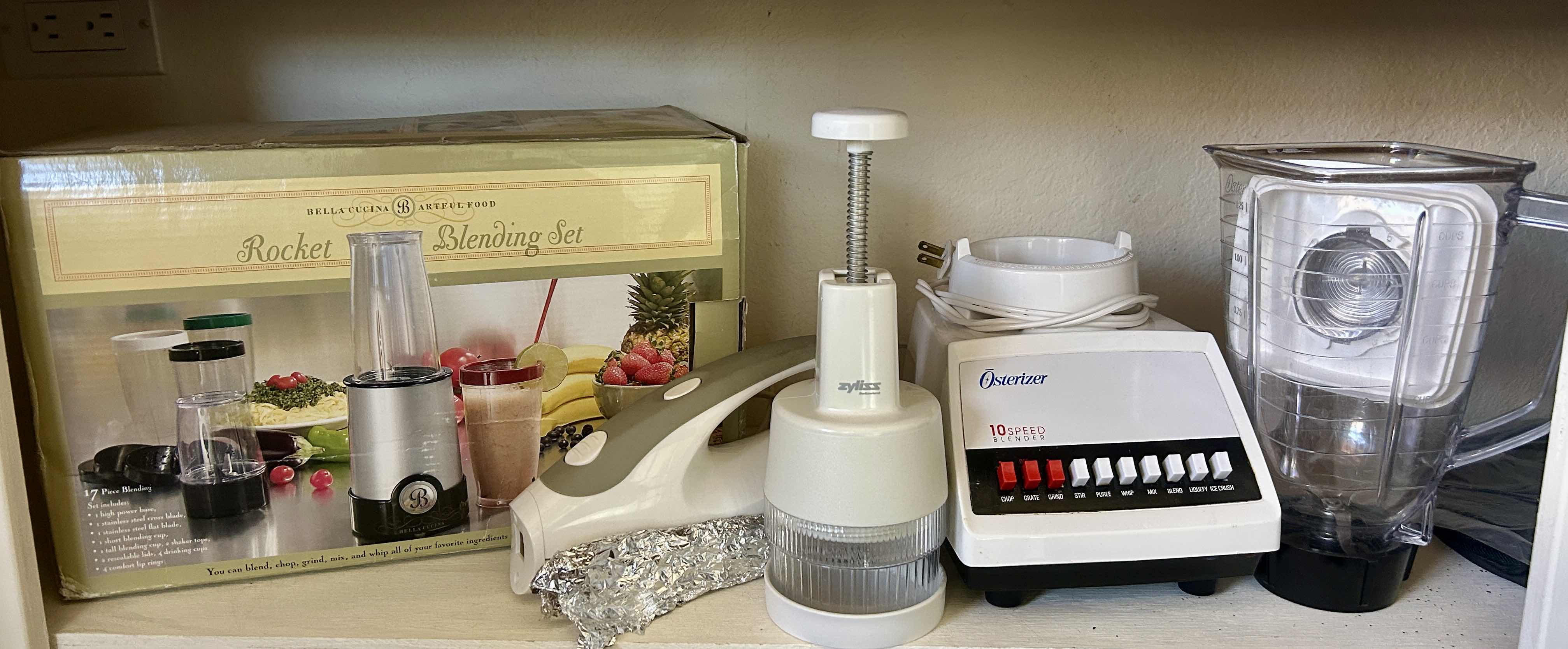 Photo 1 of CONTENTS ON SHELF IN ISLAND - ROCKET BLENDING SET, OSTERIZER BLENDER, CHOPPER AND ELECTRIC KNIFE