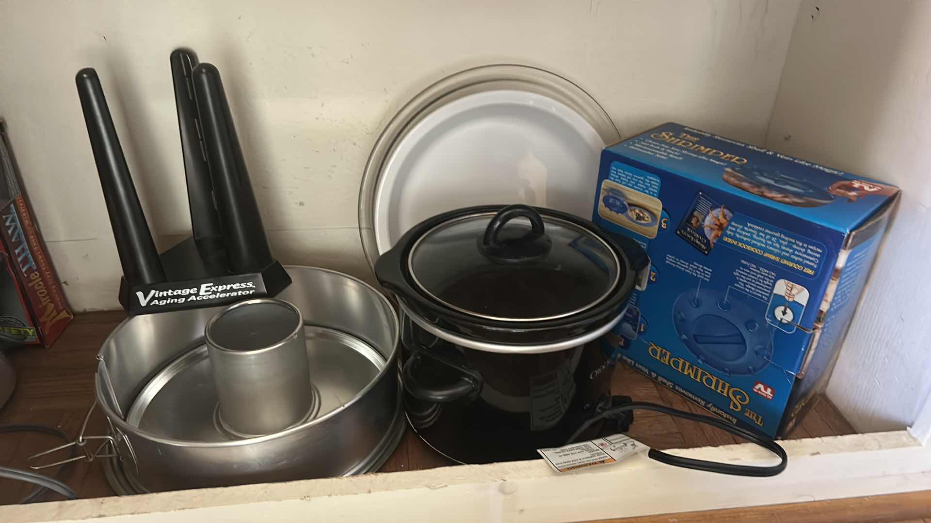 Photo 1 of CONTENTS ON 2 SHELVES - KITCHEN ISLAND- CROCKPOTS, SKILLET, BUNDT CAKE PAN AND MORE