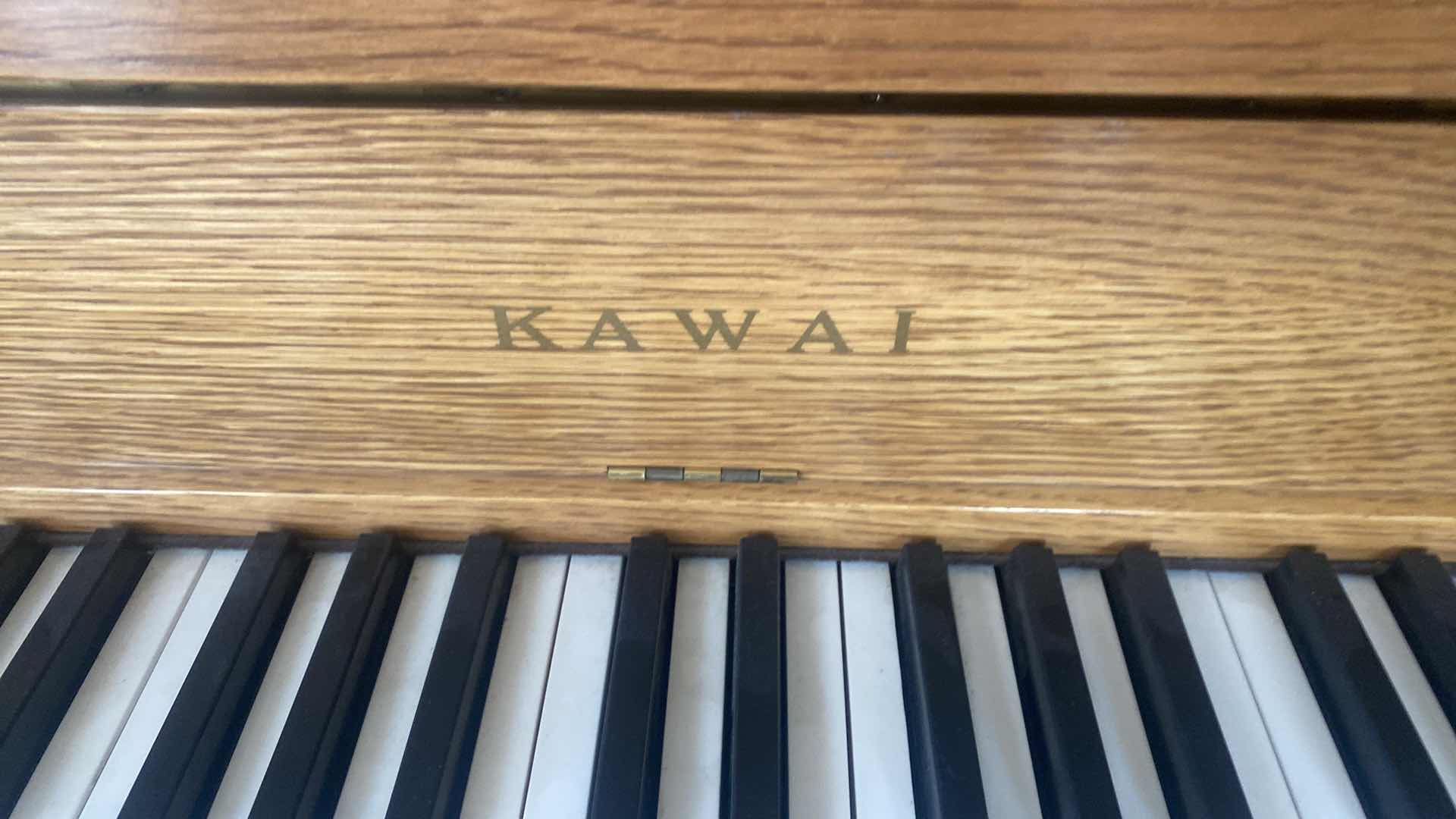 Photo 1 of KAWAI OAK UPRIGHT PIANO AND BENCH 57“ x 25“ H 42”