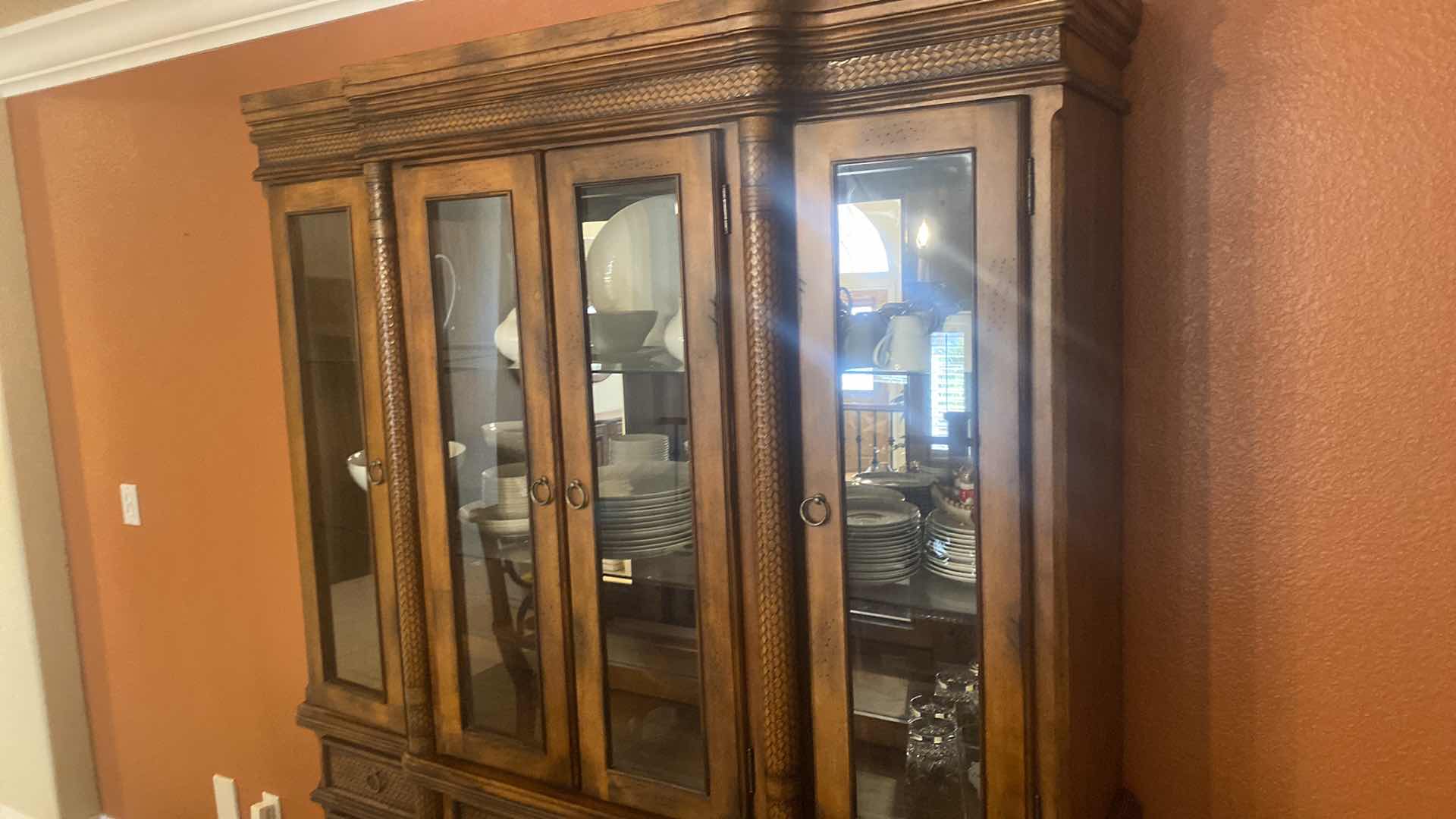 Photo 1 of ASHLEY FURNITURE WOOD CHINA DISPLAY WITH WOOD BRAID ACCENTS AND DOVETAIL DRAWERS 62” x 17” H81” (contents not included)