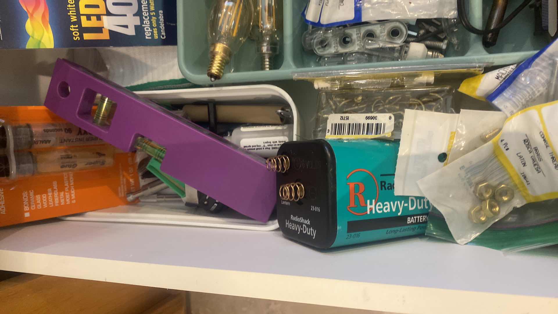 Photo 1 of CONTENTS OF KITCHEN DRAWER-BULBS TOOLS & MISC TOOLS