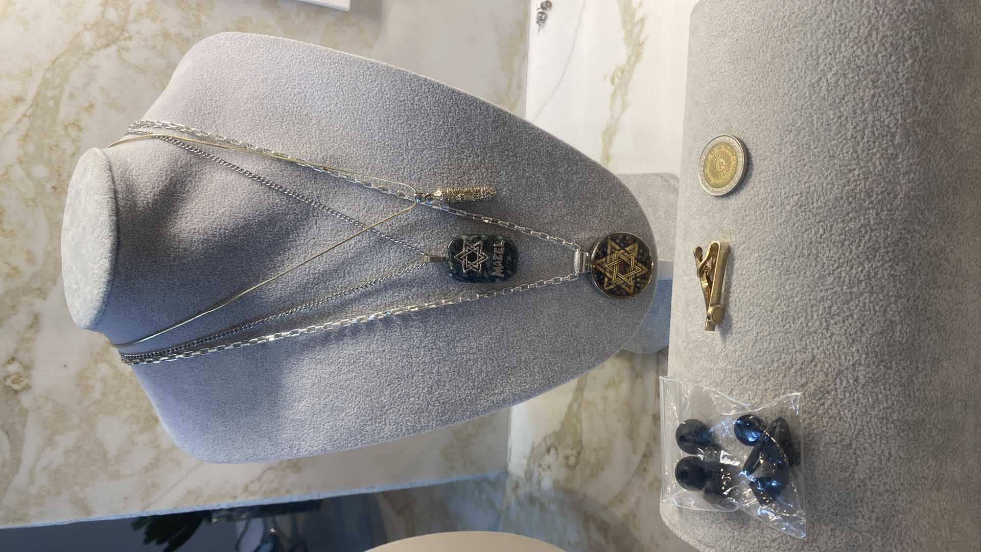 Photo 1 of COSTUME JEWELRY- 3 NECKLACES, COIN & CLIP