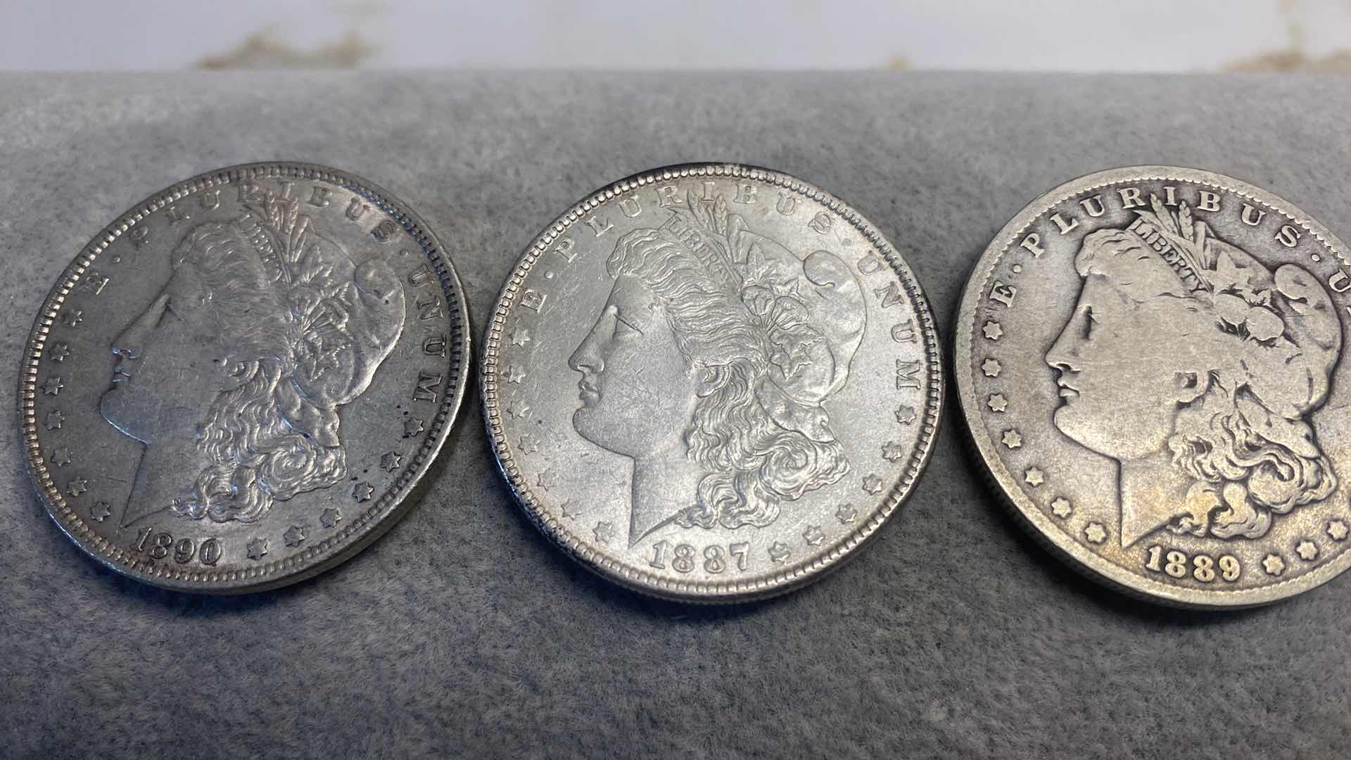 Photo 1 of 3-SILVER MORGAN DOLLARS FROM THE 1800’s INCLUDES PLASTIC CONTAINER