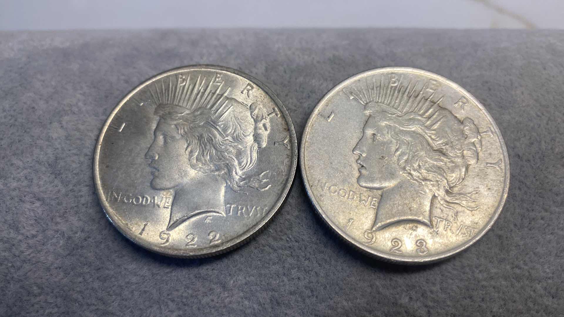 Photo 1 of 2-PEACE SILVER DOLLARS FROM EARLY 1900’s INCLUDES PLASTIC CONTAINER
