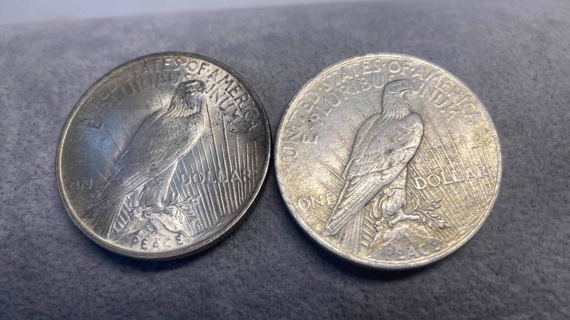 Photo 1 of 2-PEACE SILVER DOLLARS FROM EARLY 1900’s INCLUDES PLASTIC CONTAINER