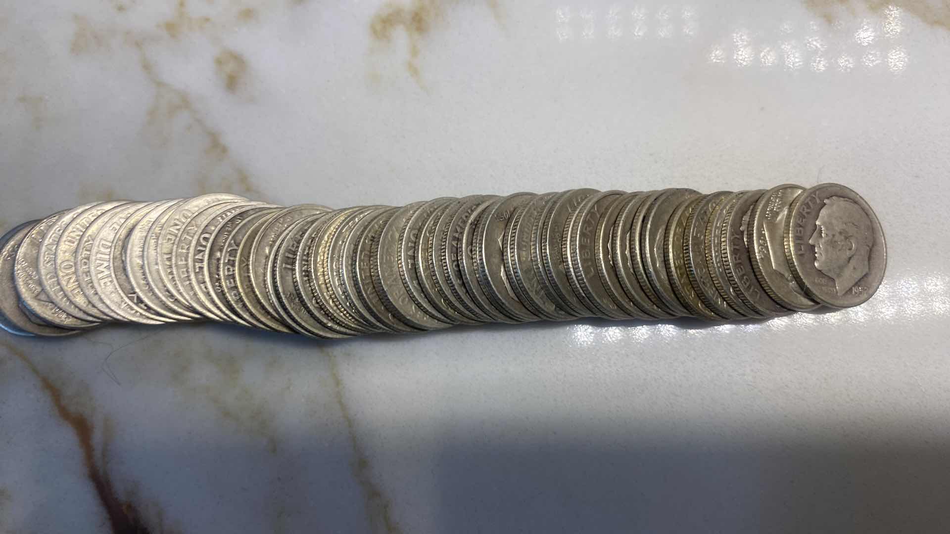 Photo 1 of 49- 90% SILVER DIMES IN TUBE FROM MID 1900’s