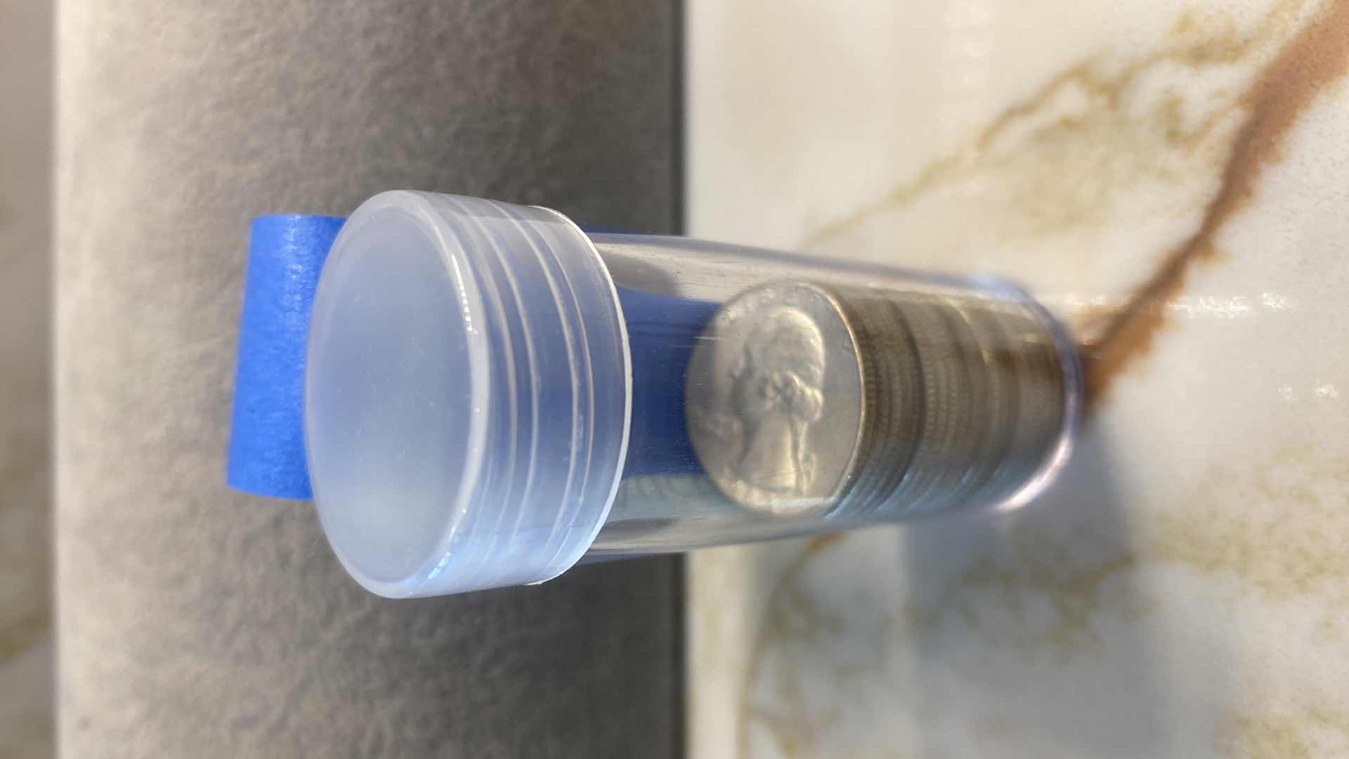 Photo 1 of 19-90% SILVER QUARTERS FROM 1900’s (VARIOUS YEARS) TUBE INCLUDED