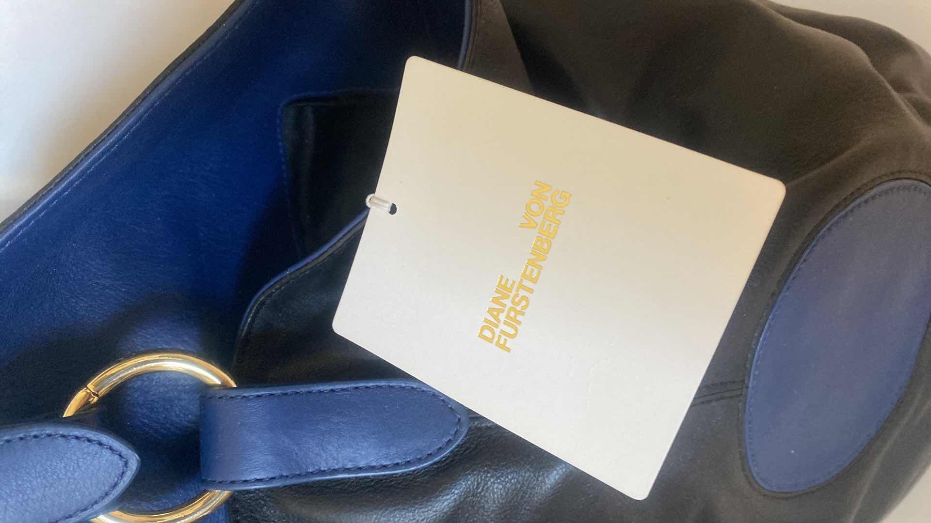 Photo 2 of NWT DIANE VON FÜRSTENBERG STEAMER LEATHER  HANDBAG BLACK/MARINE BLUE 9” x 15” EXCLUDING STRAP