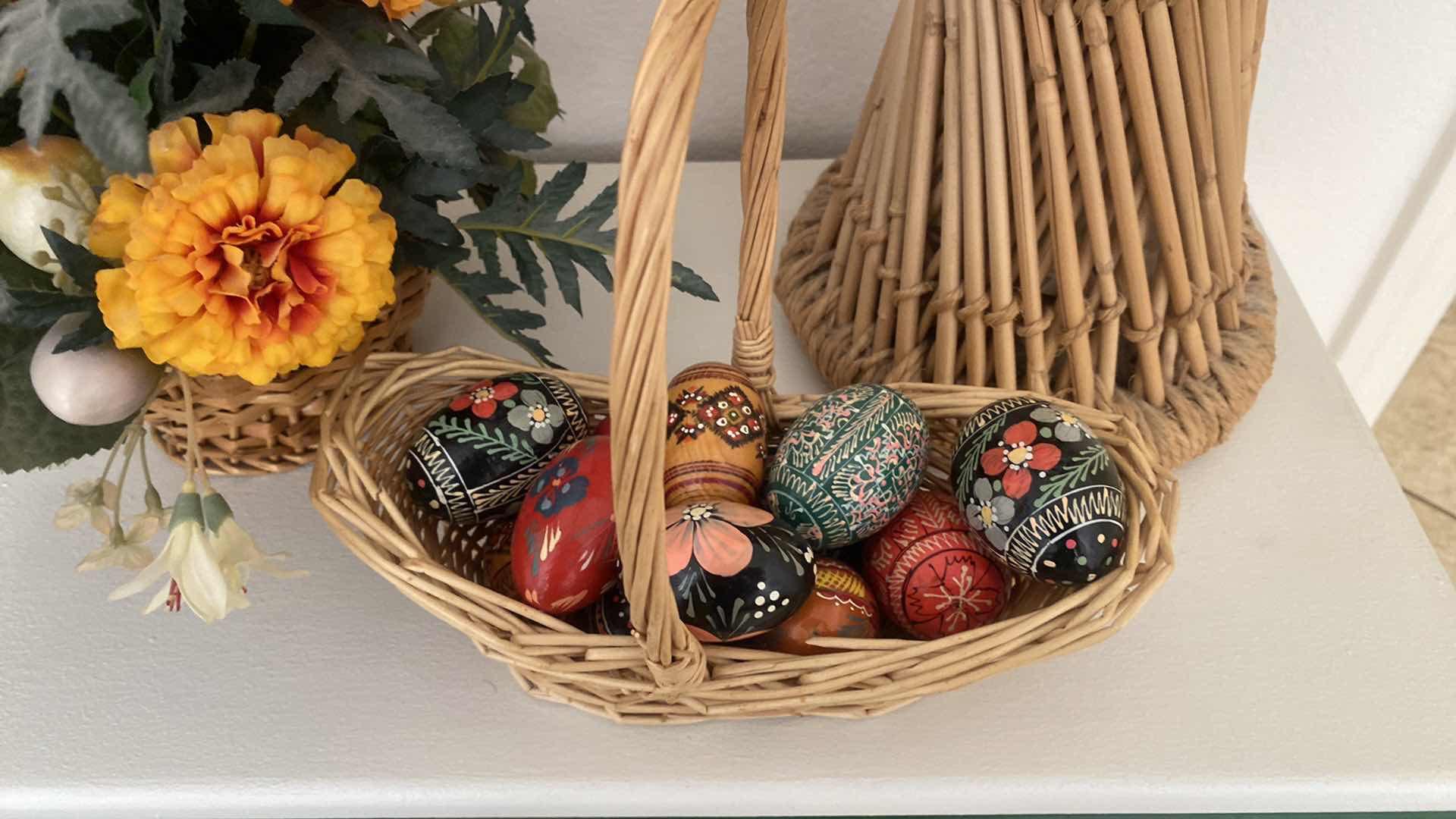 Photo 1 of 17” WICKER ROUND MIRROR 2 FLORALS & BASKET OF HAND PAINTED WOOD EGGS