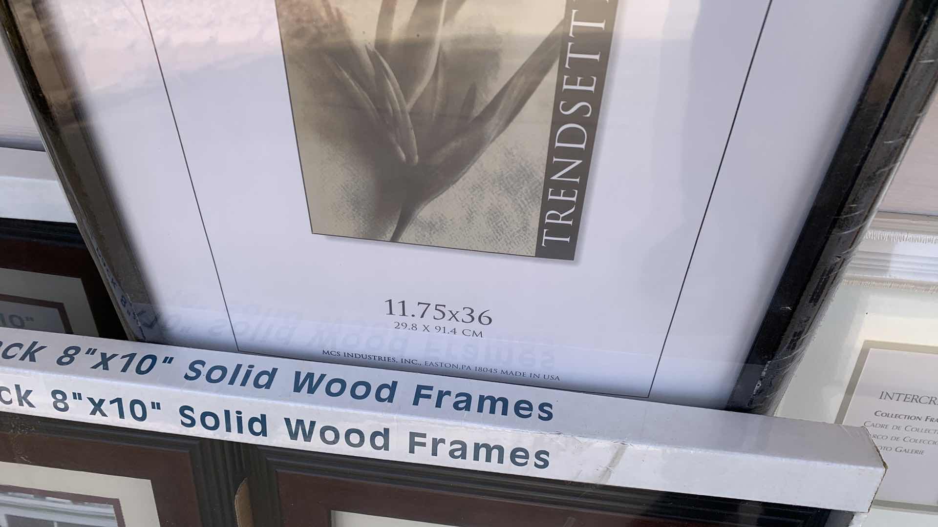 Photo 1 of 4-PICTURE FRAMES AND A CORK BOARD