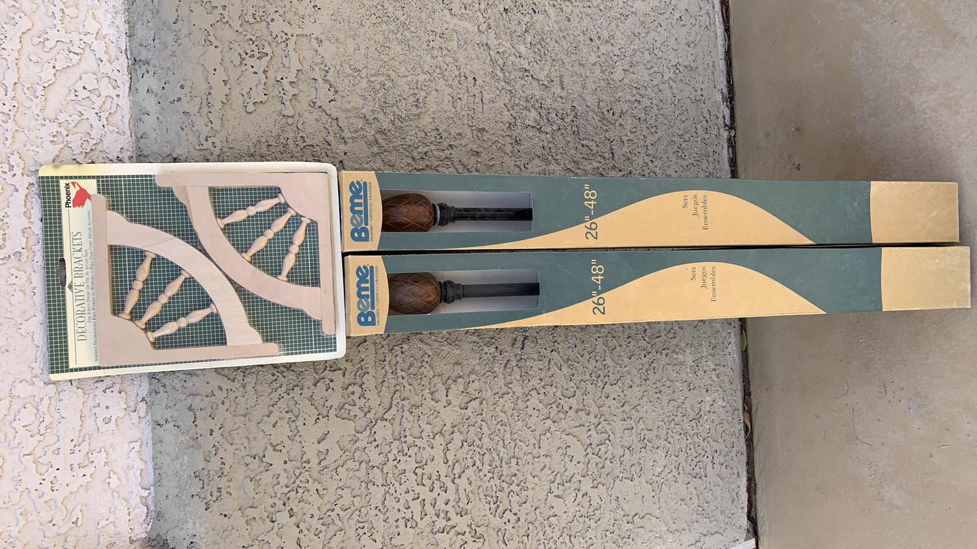 Photo 1 of 2-CURTAIN RODS AND DECORATIVE BRACKETS