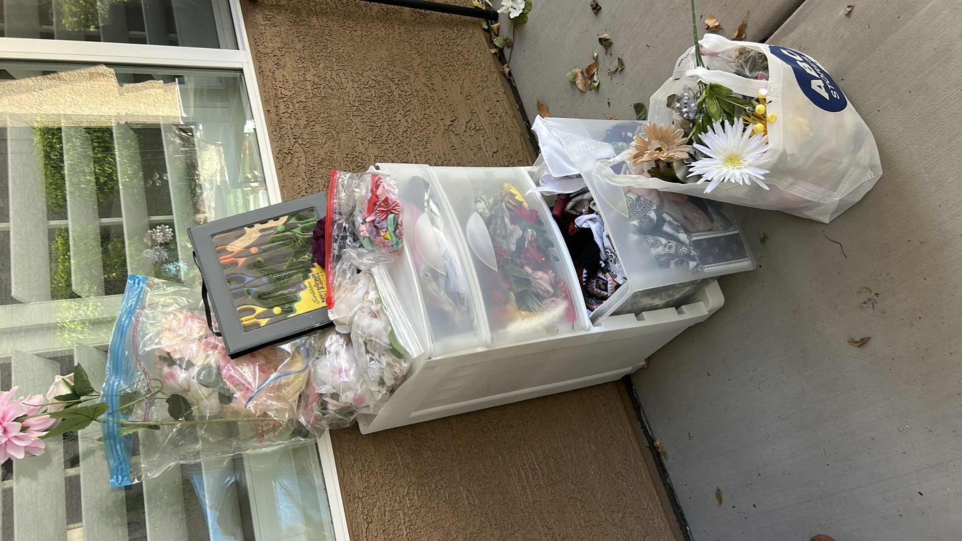 Photo 1 of ROLLED STORAGE WITH CRAFTING SUPPLIES, FAUX FLOWERS AND FABRIC